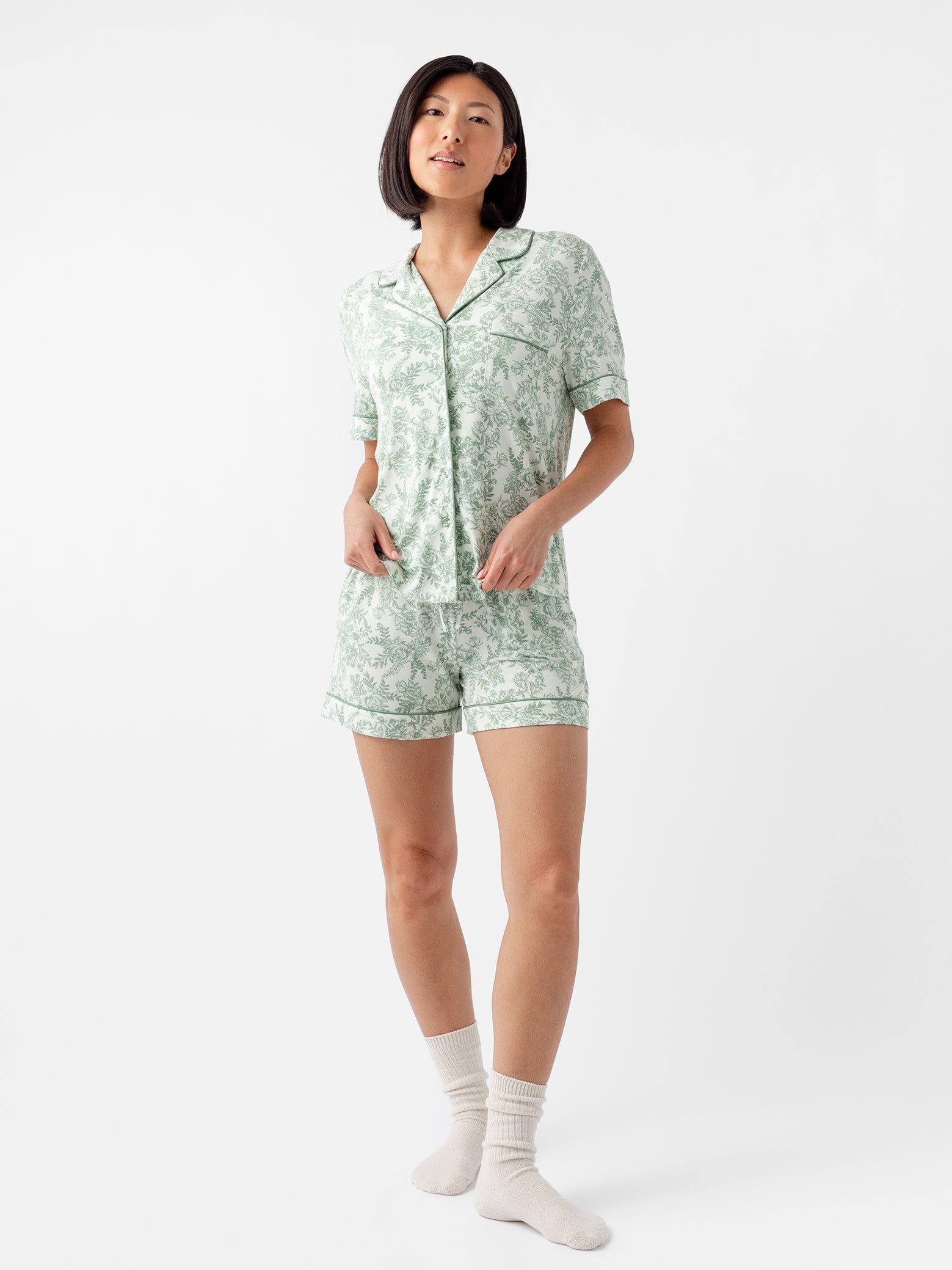 Woman in short sleeve celadon toile pajama set with white background 