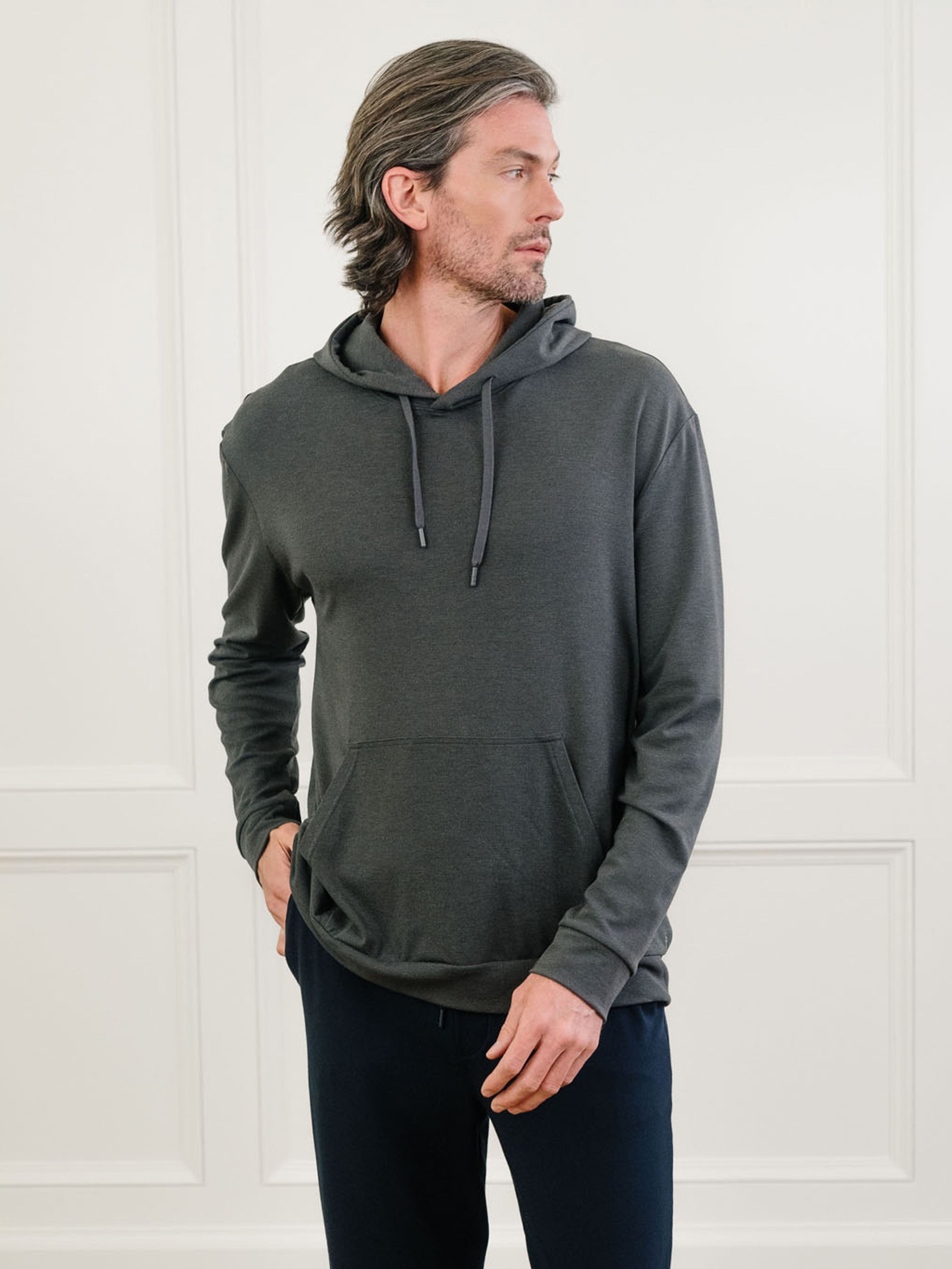 Charcoal Bamboo Hoodie worn by man standing in front of white background.|Color:Charcoal