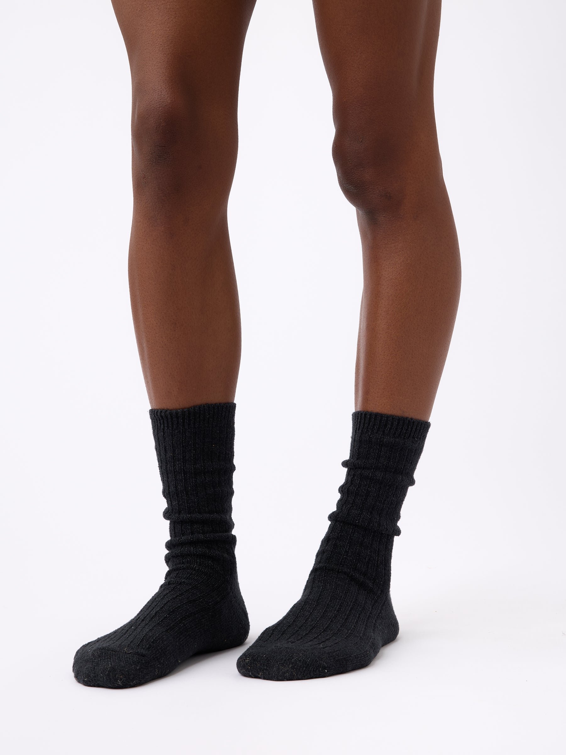 Person wearing Cozy Earth Plush Lounge Sock in Charcoal |Color:Charcoal/Coal/Stone