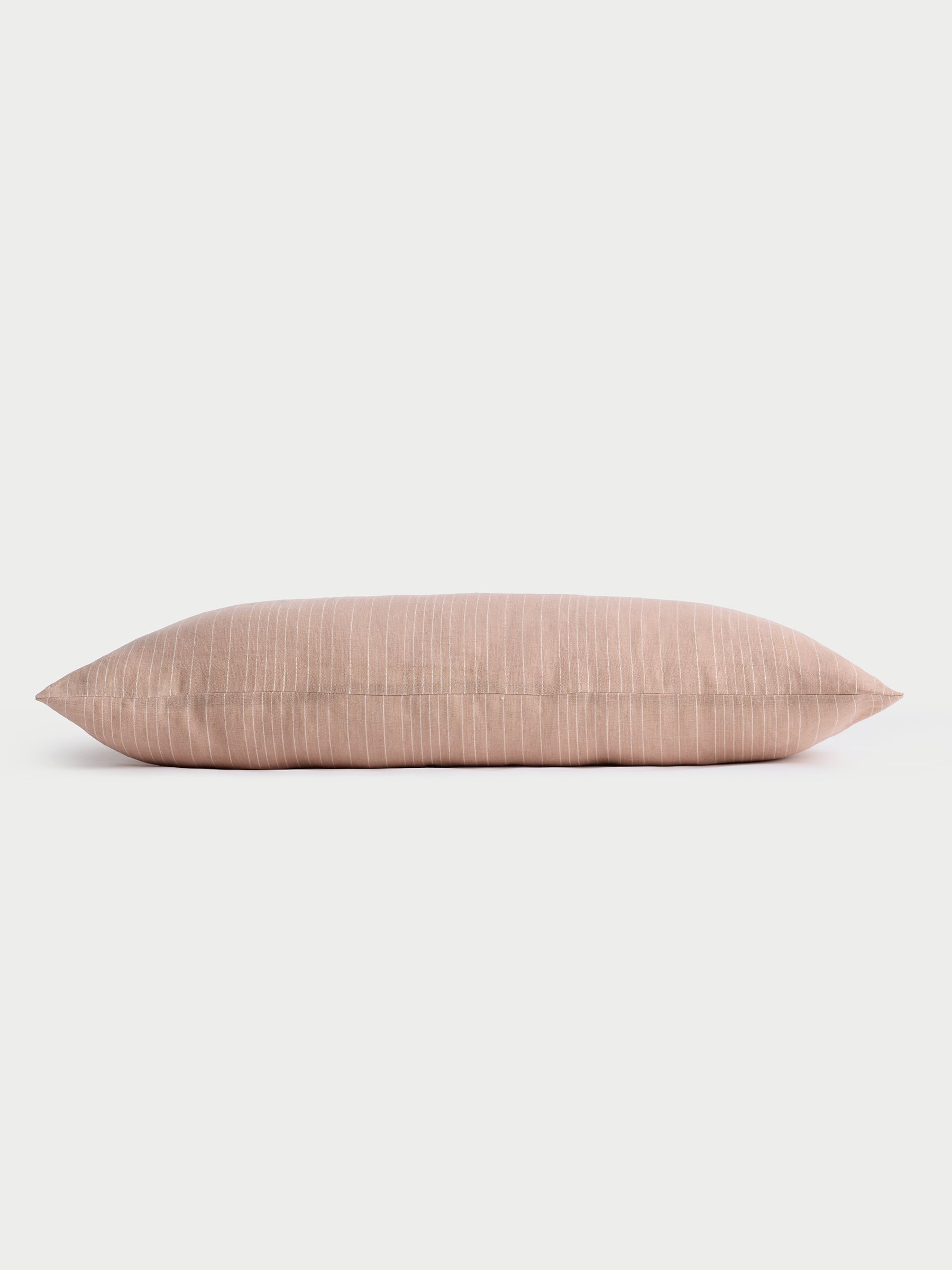 Cozy Earth striped throw pillow with plain white background 
