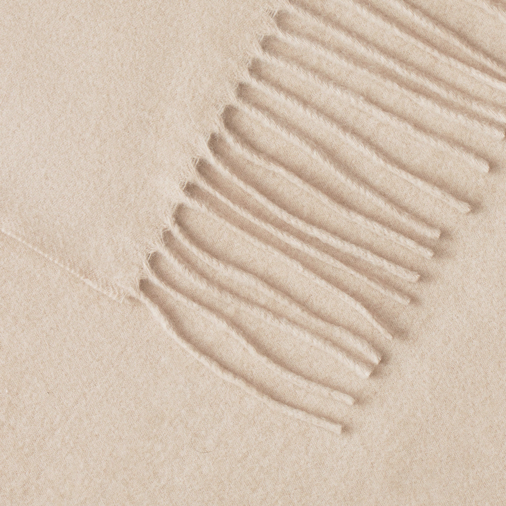 Close up of tassels on dune cashmere throw |Color:Dune