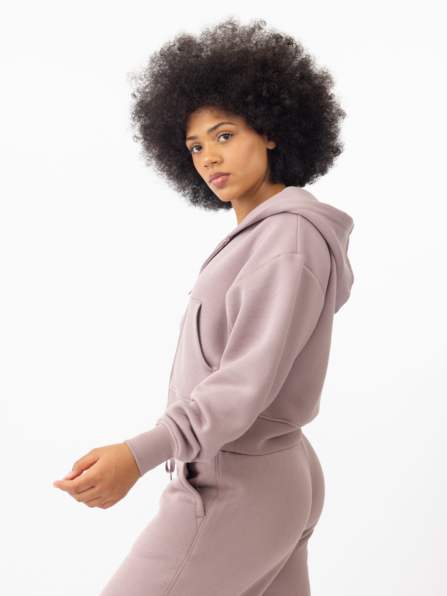 Woman wearing Dusty Orchid CityScape Cropped Full Zip with white background 