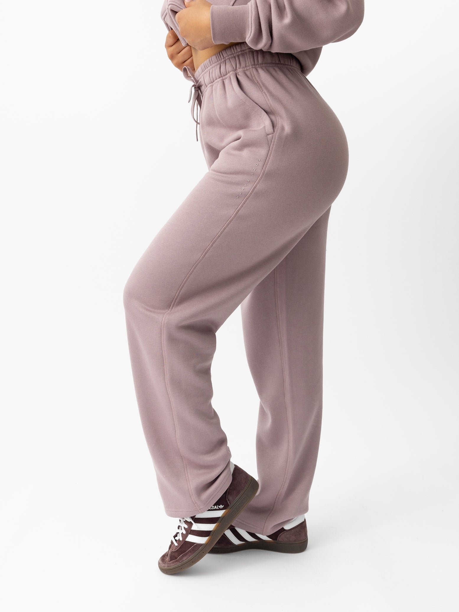 Woman wearing Dusty Orchid CityScape Wide Leg Pant with white background 