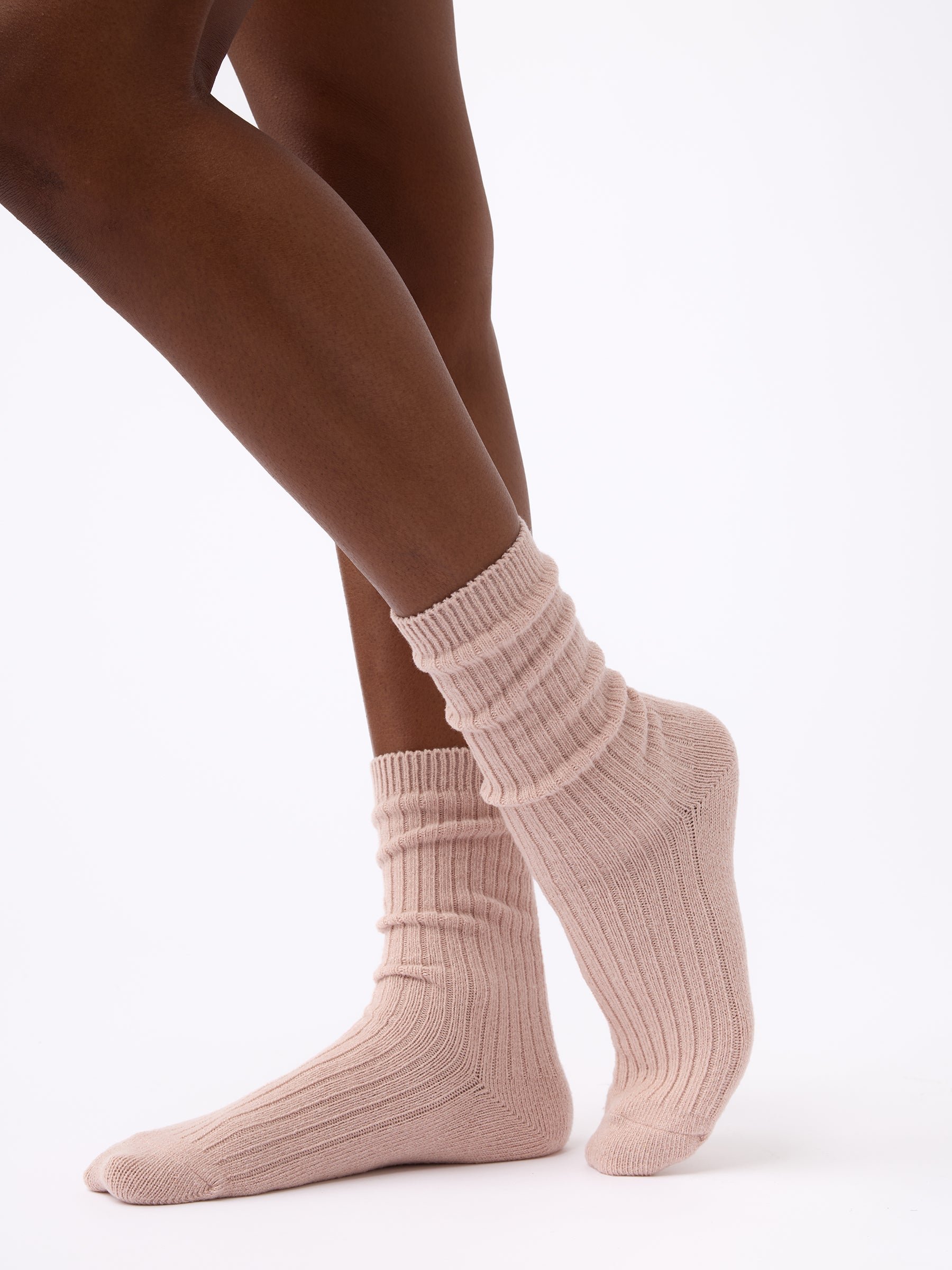 Person turned to the side wearing Cozy Earth Plush Lounge Sock 1-Pack in Dusty Rose |Color:Dusty Rose