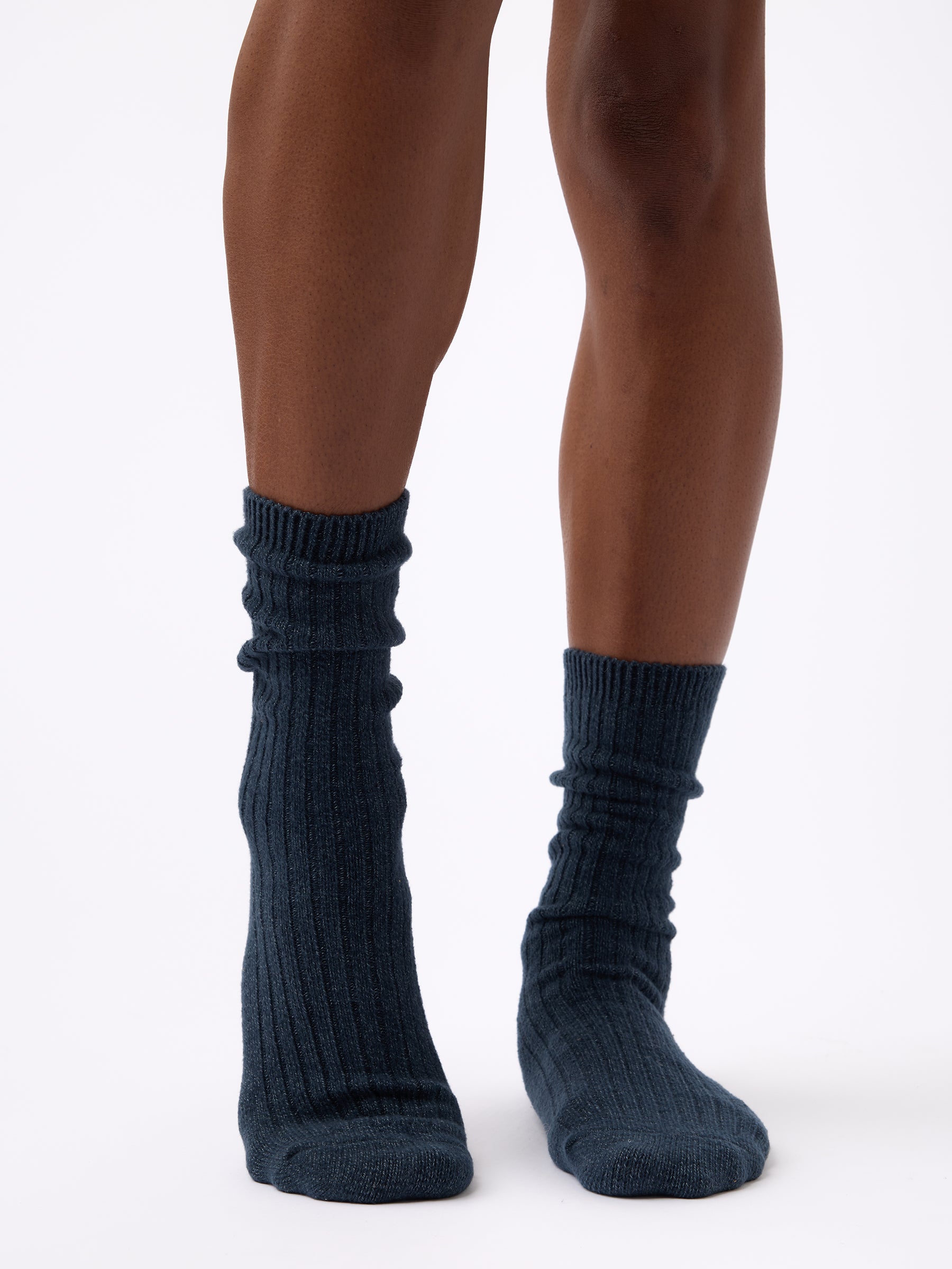 Person wearing Cozy Earth Plush Lounge Sock in Eclipse 
|Color:Eclipse/Deep Blue/Smokey Blue