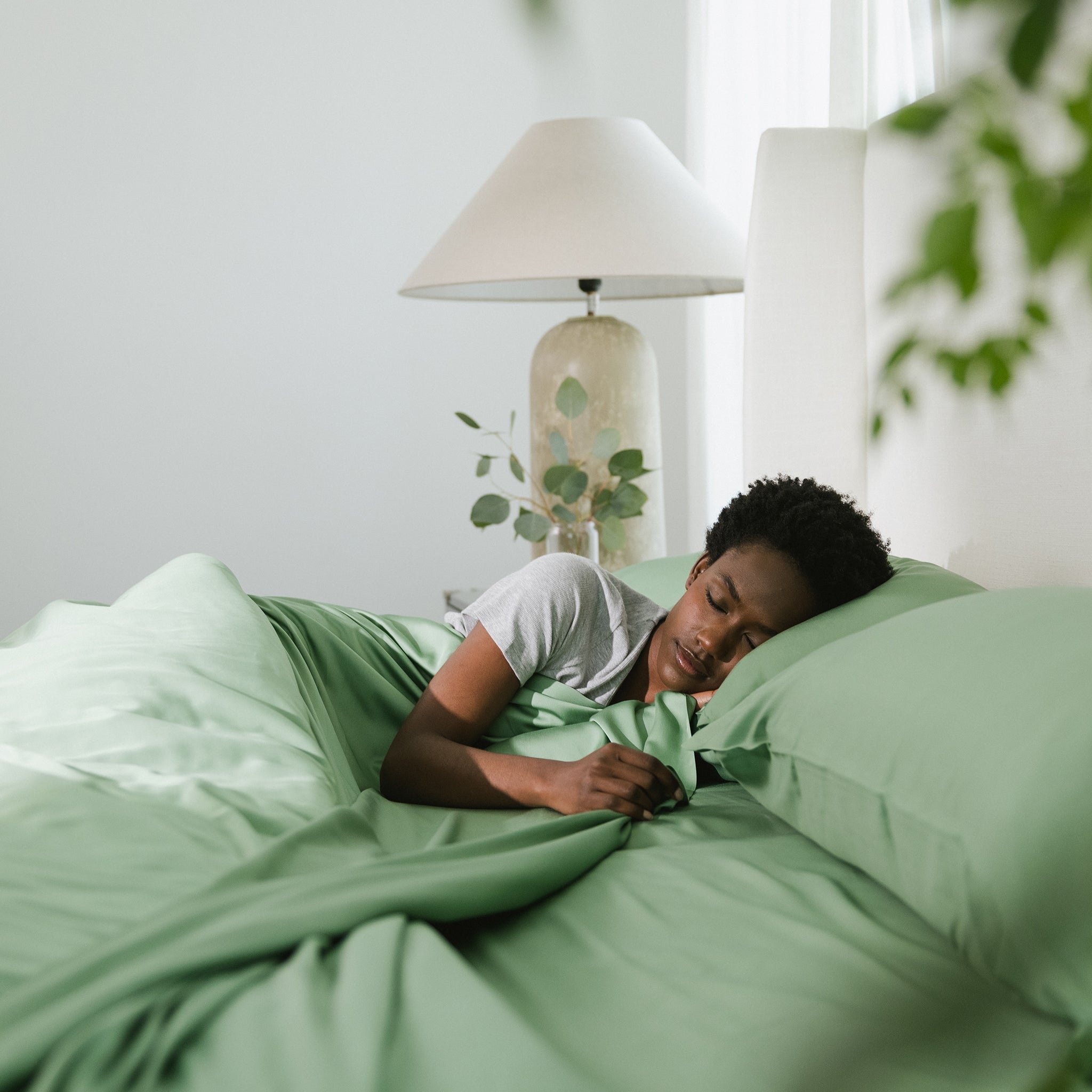 Women sleeping in fern bedding 