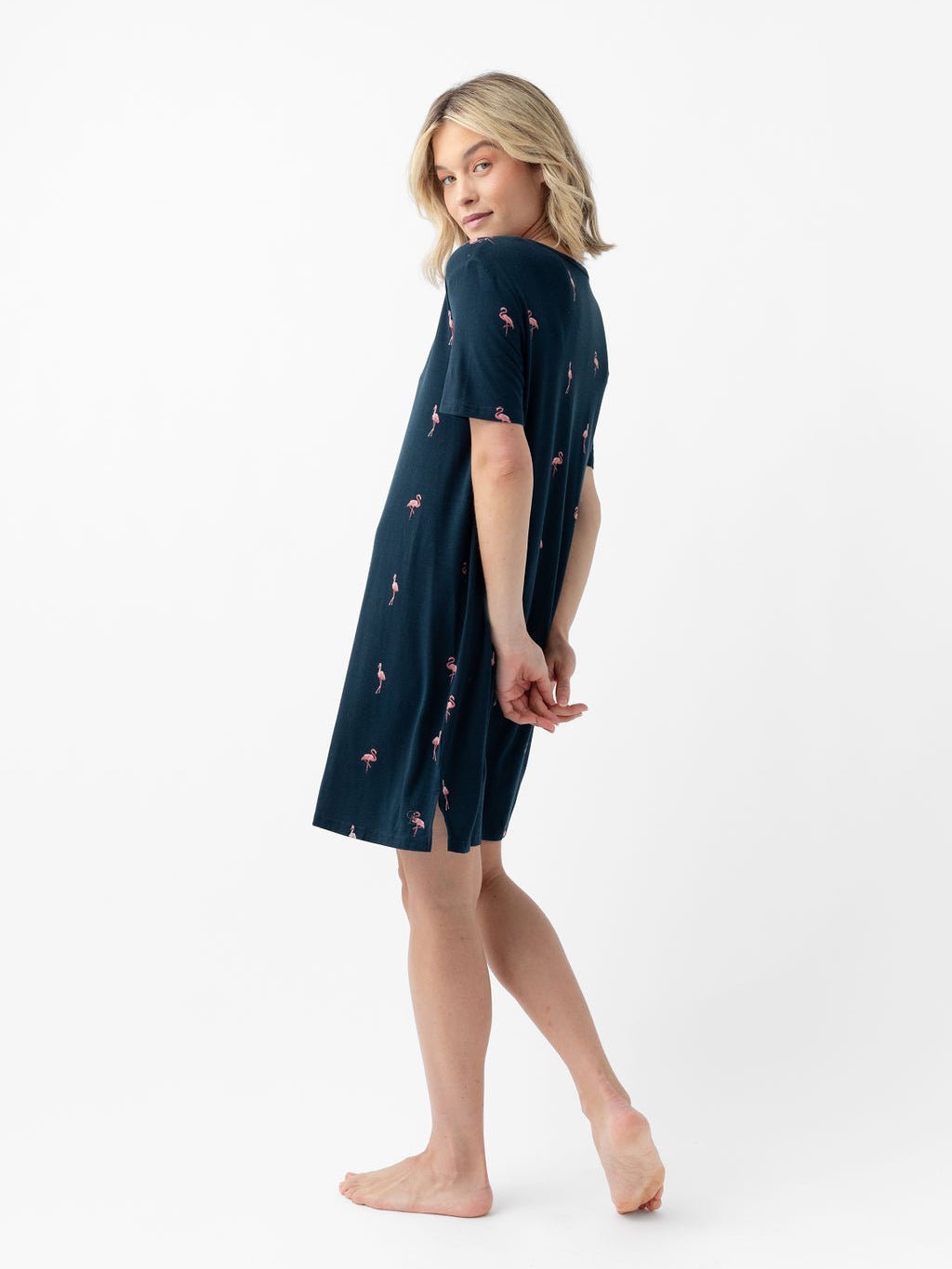 Woman wearing flamingo print sleep dress with white background 