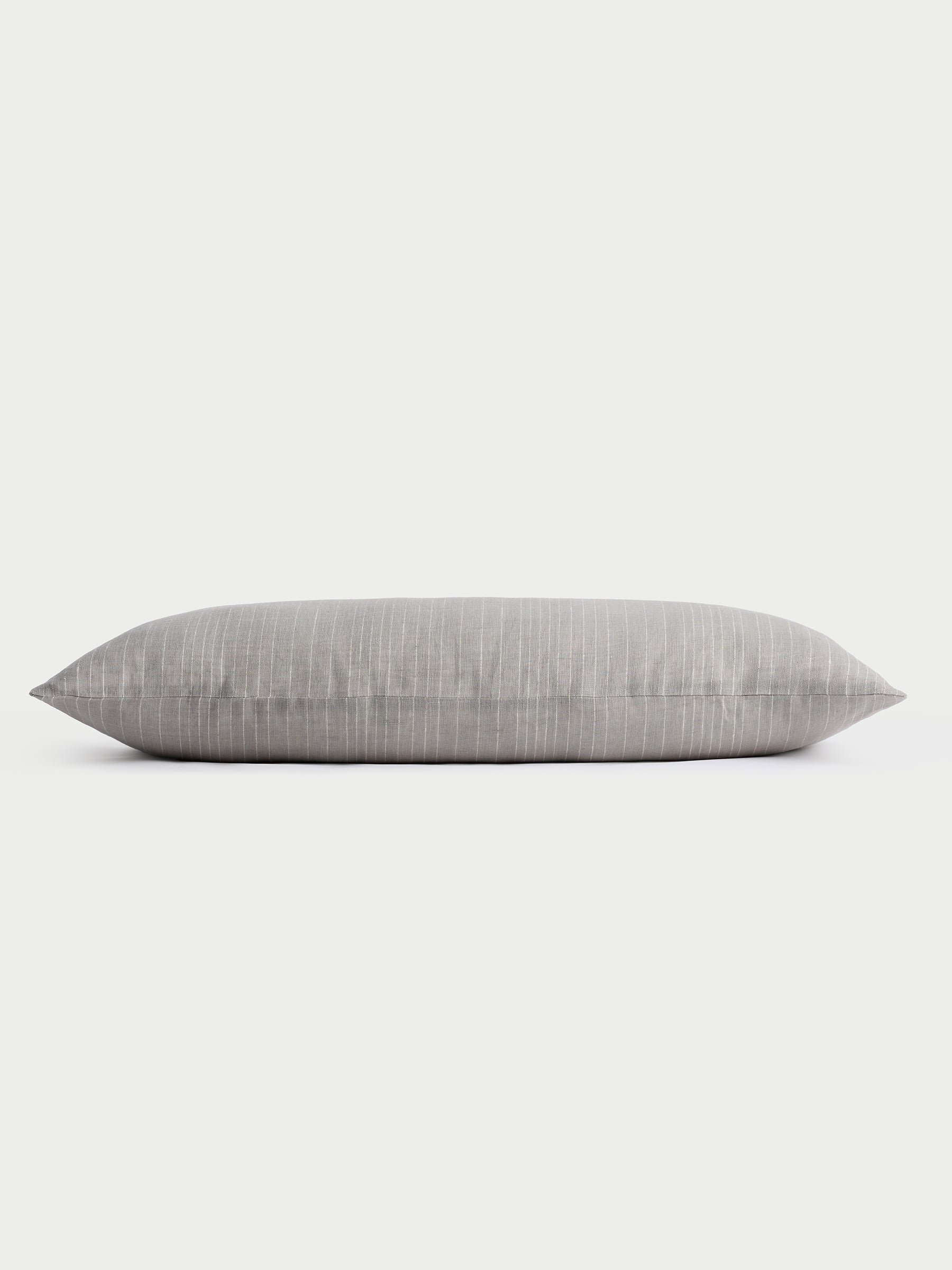 Cozy Earth striped throw pillow with plain white background 