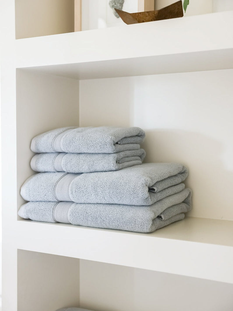 Luxe bath towels and hand towels on shelf