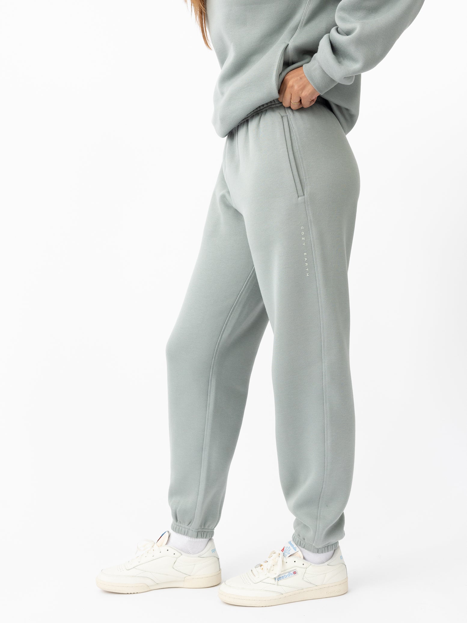 Woman wearing haze cityscape joggers with white background 