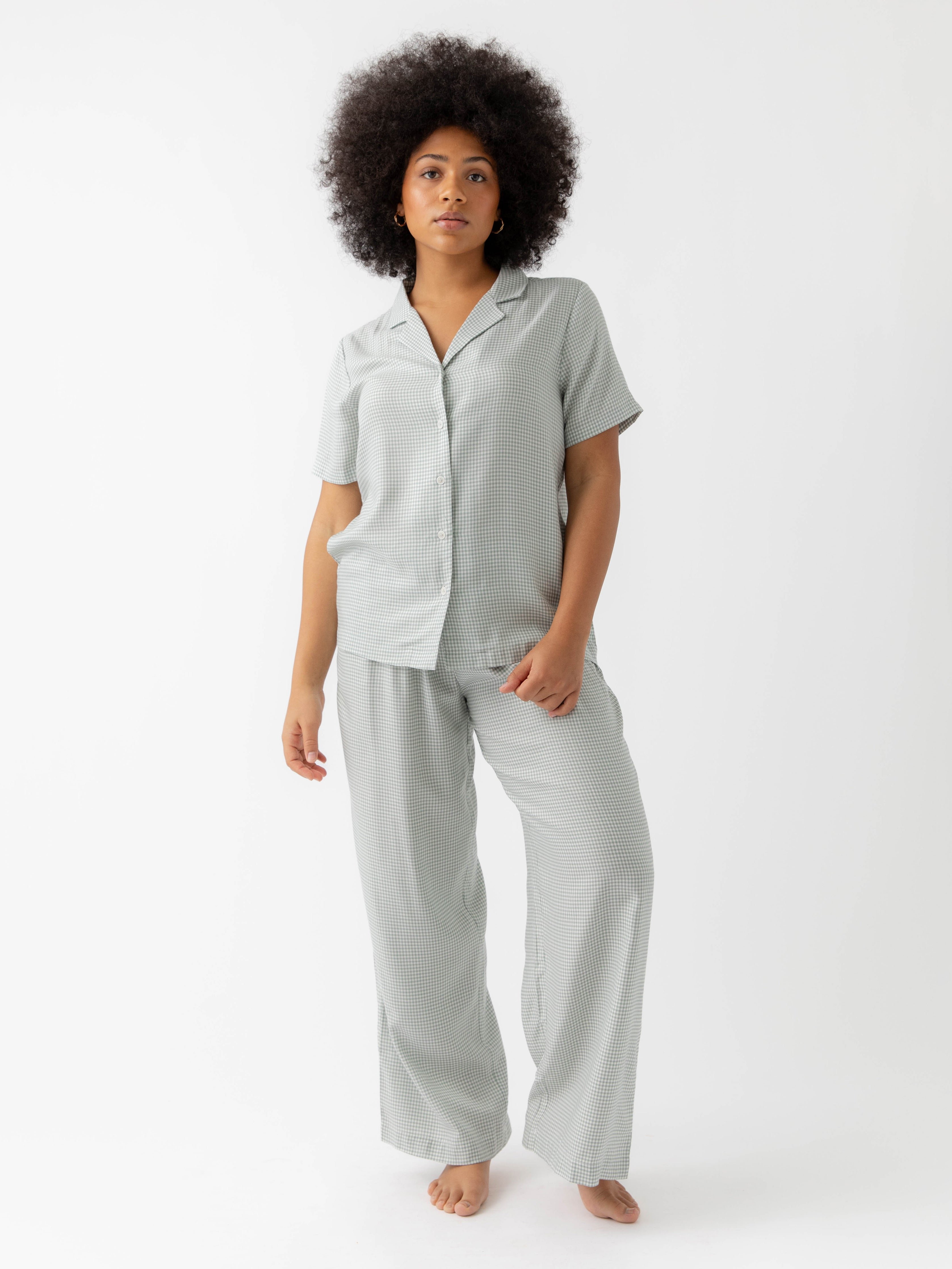 Woman in haze mini gingham pajama set with white background 