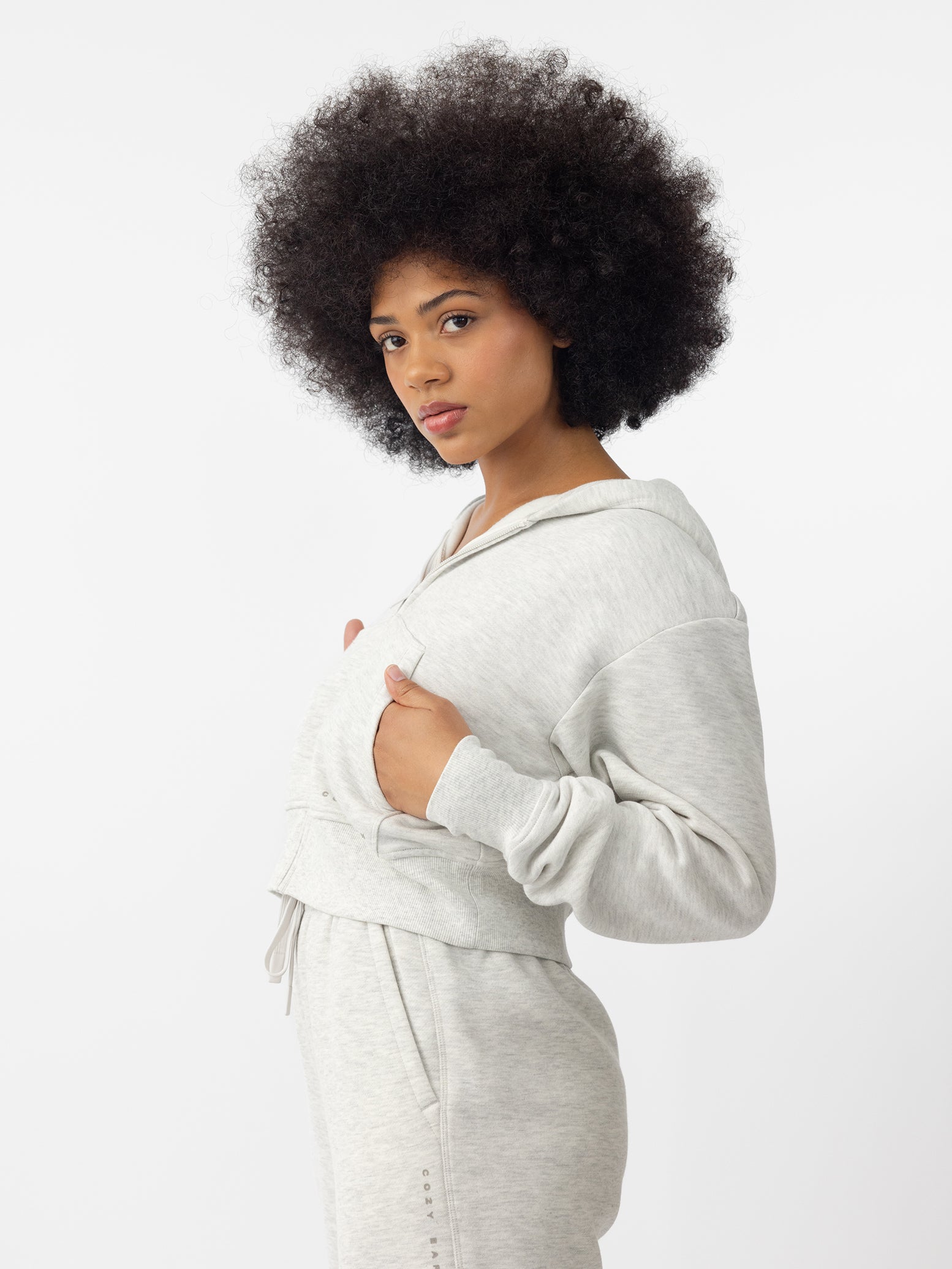 Woman wearing Heather Grey CityScape Cropped Full Zip with white background 