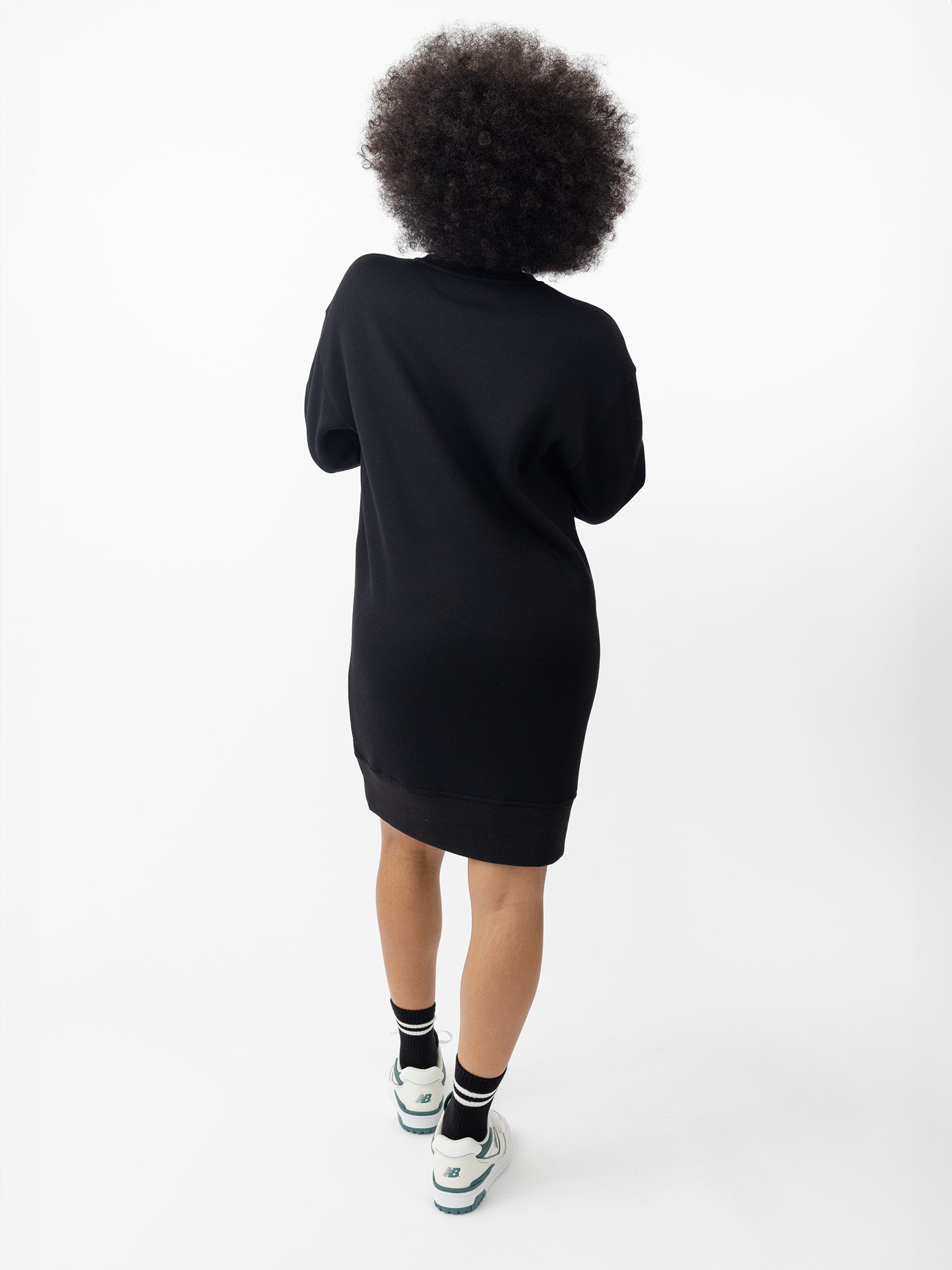 Woman wearing Black CityScape Crewneck Dress with white background 