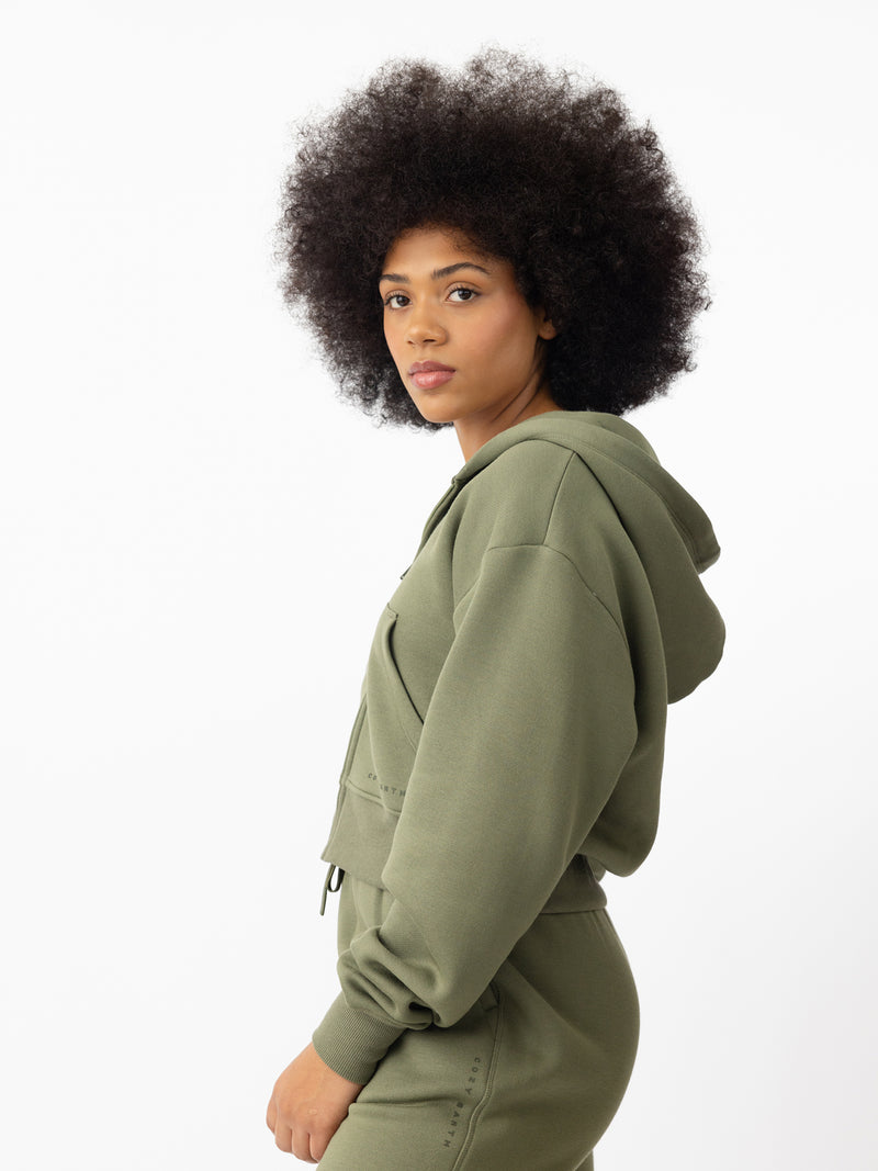 Woman wearing Juniper CityScape Cropped Full Zip with white background