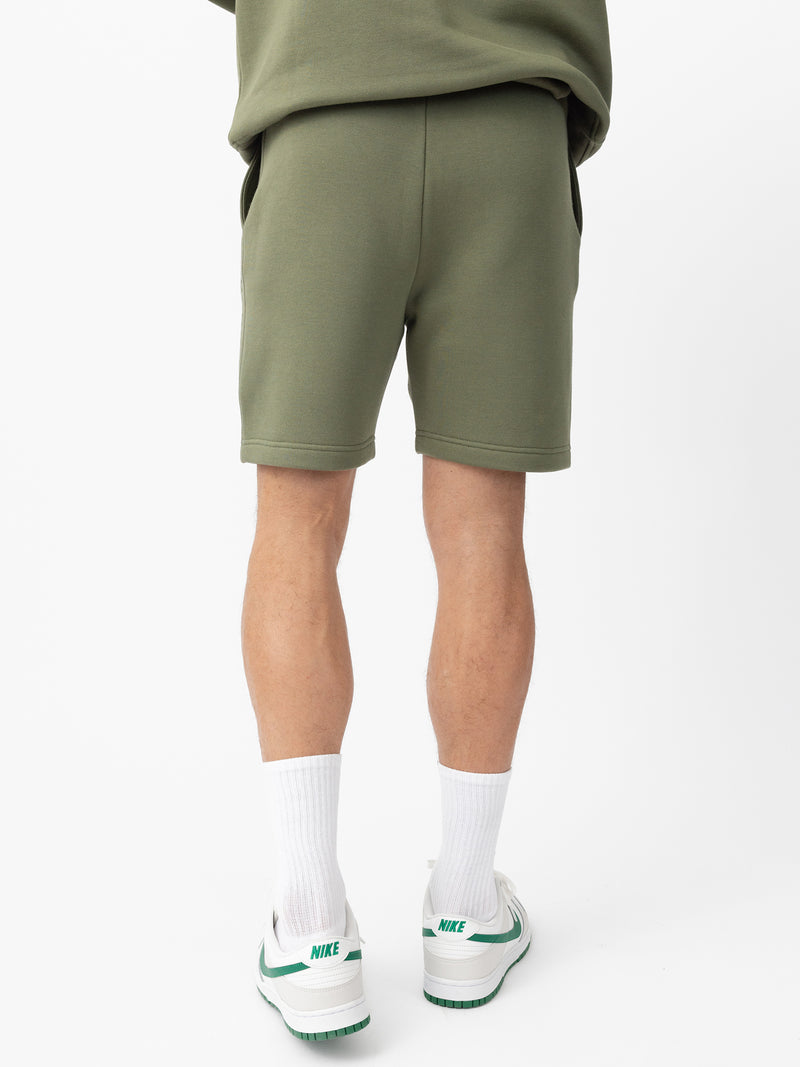 Man wearing Juniper CityScape Shorts with white background