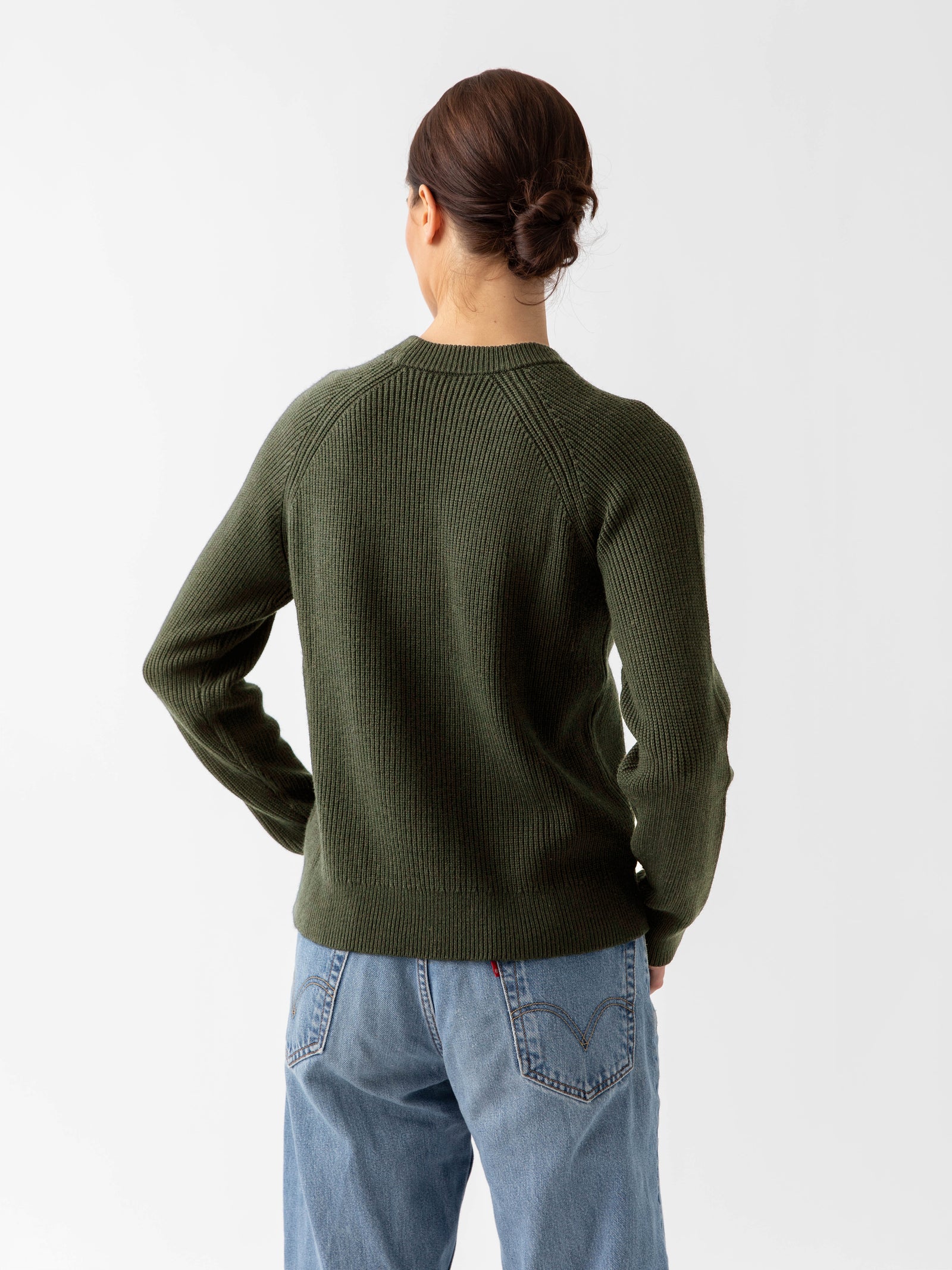 Back of woman wearing juniper classic crewneck and jeans with white background 