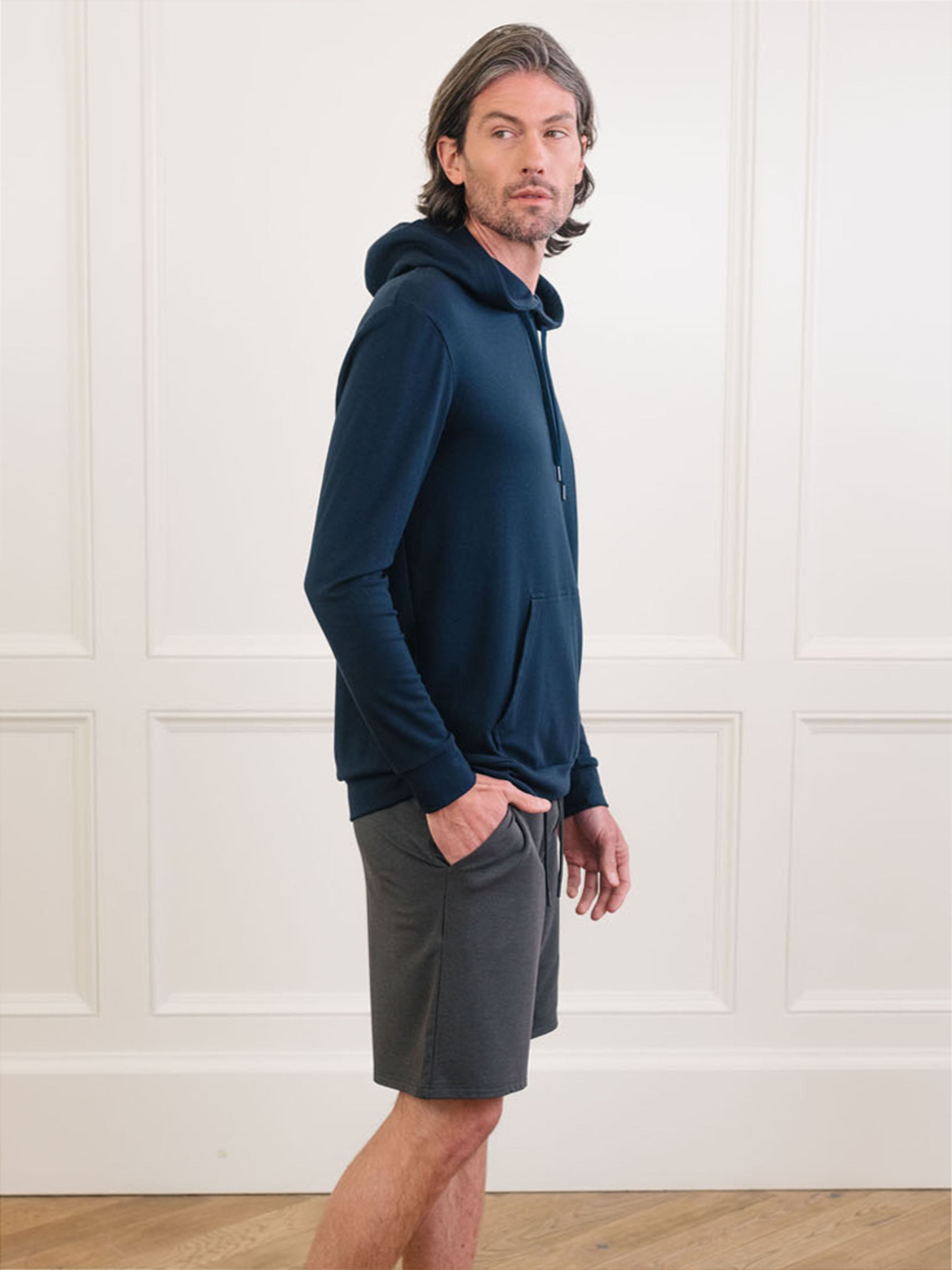 Navy Bamboo Hoodie worn by man standing in front of white background.|Color:Navy