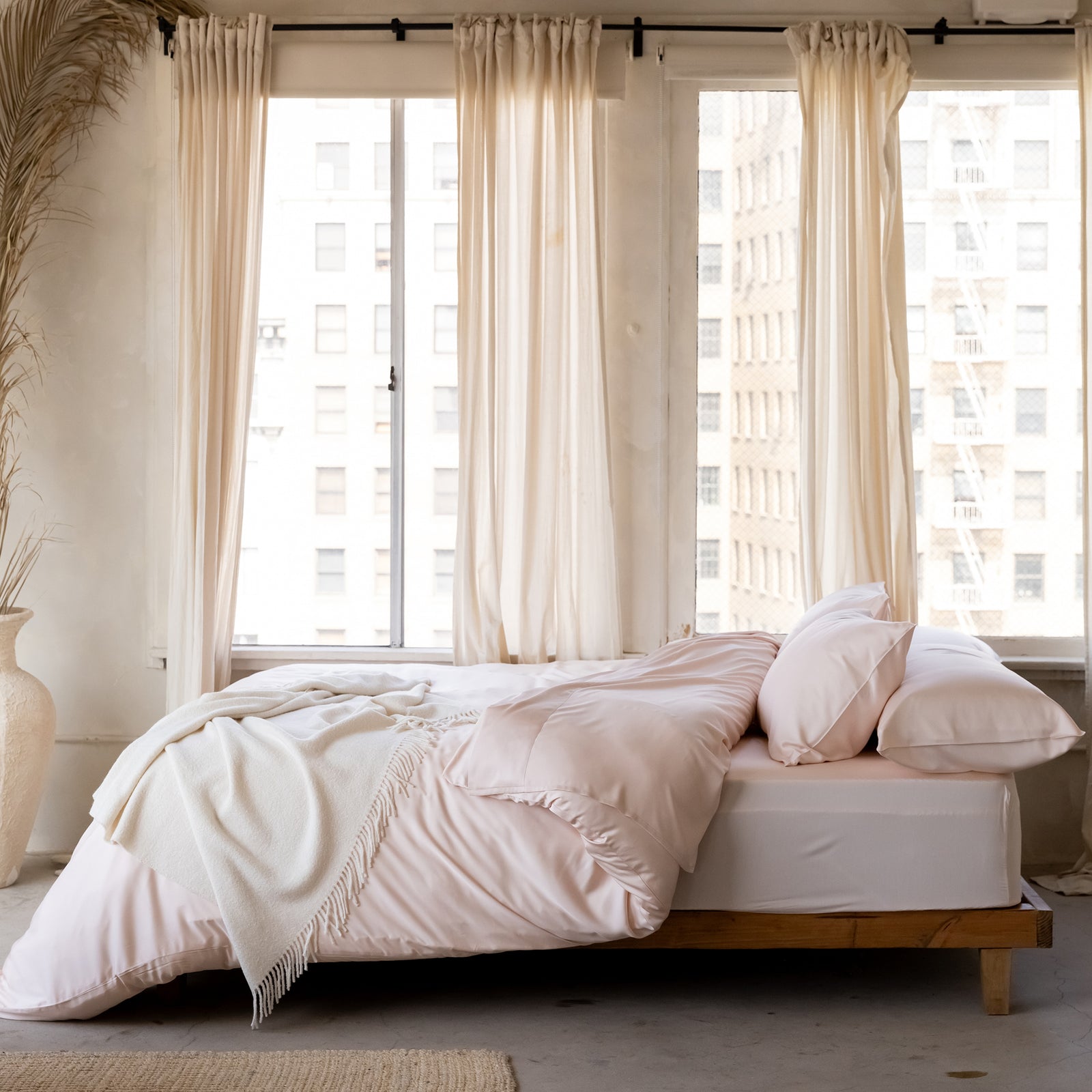 Bed under windows with peony bedding 