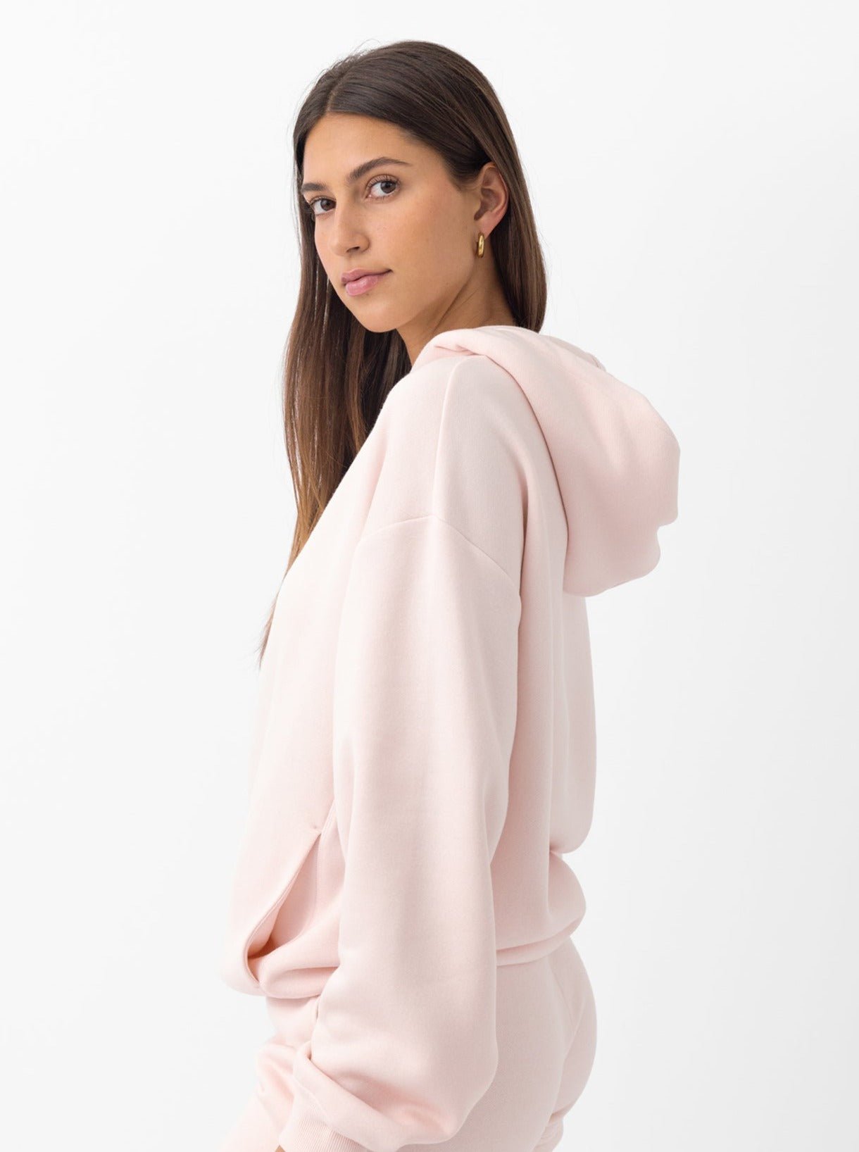 Side view of woman wearing peony cityscape hoodie 