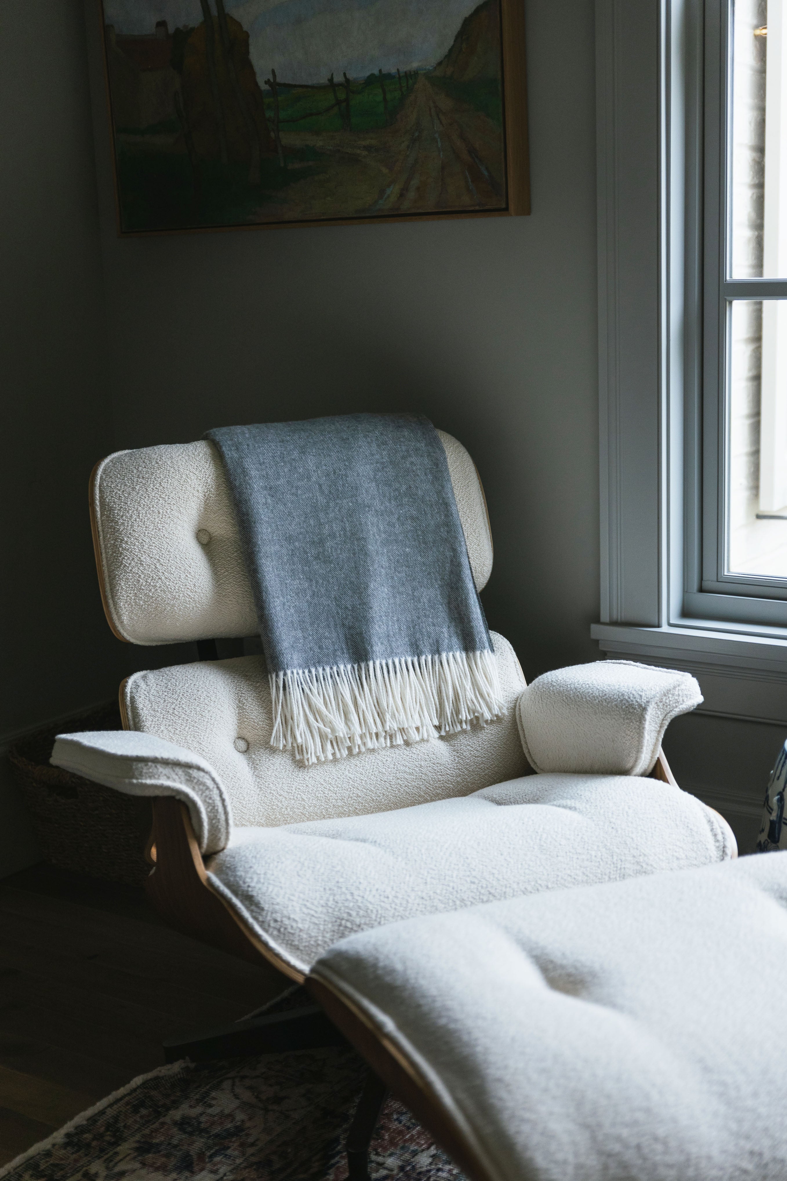 Shadow throw draped over a chair in living room |Color:Shadow