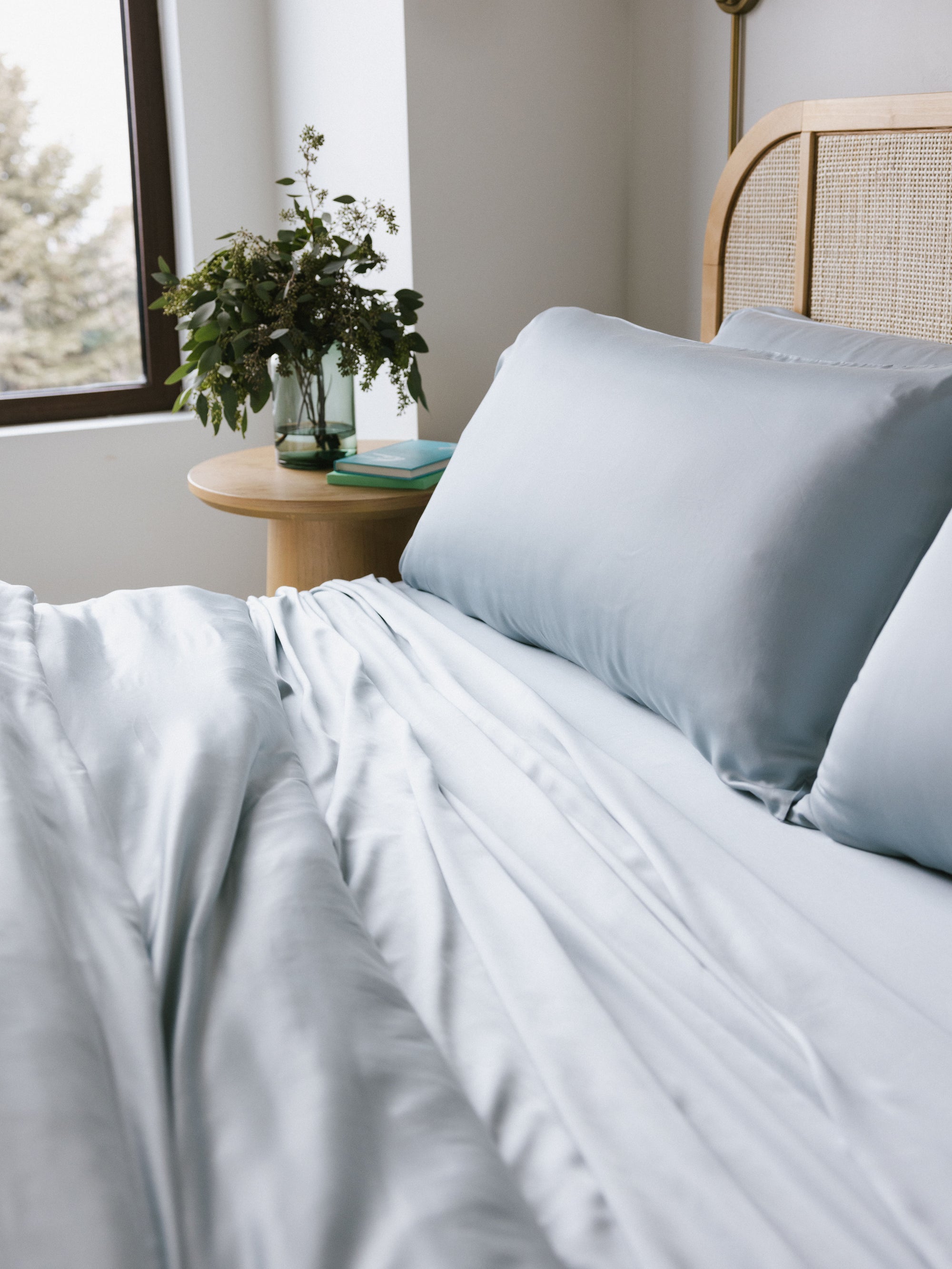 Partially made bed with shore bedding standard/king/body 