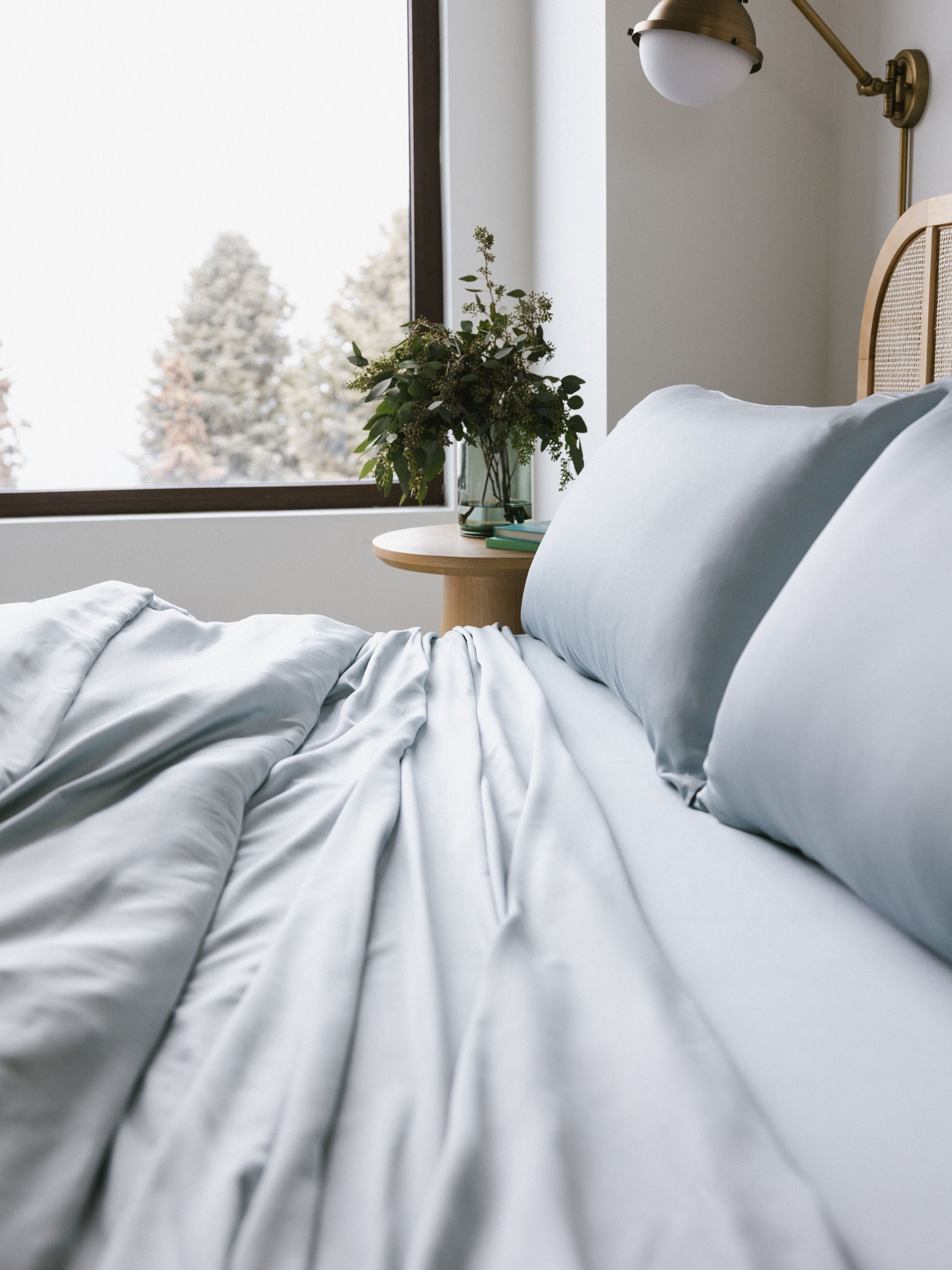 Side view of shore bedding on partially made bed 