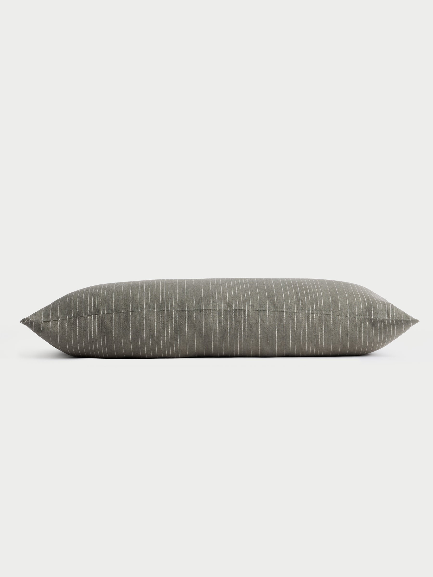 Cozy Earth striped throw pillow with plain white background 