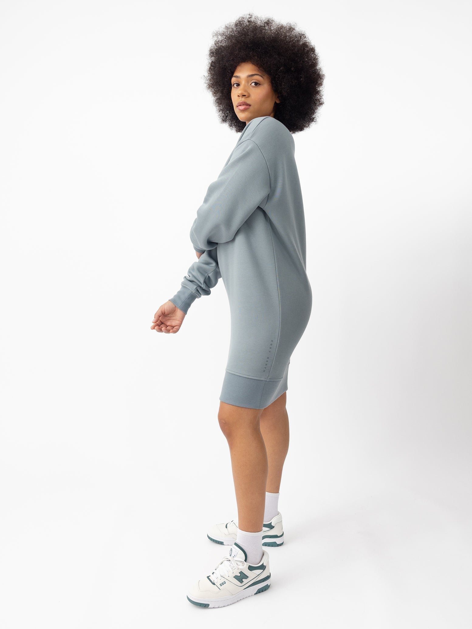 Woman wearing Smokey Blue CityScape Crewneck Dress with white background 