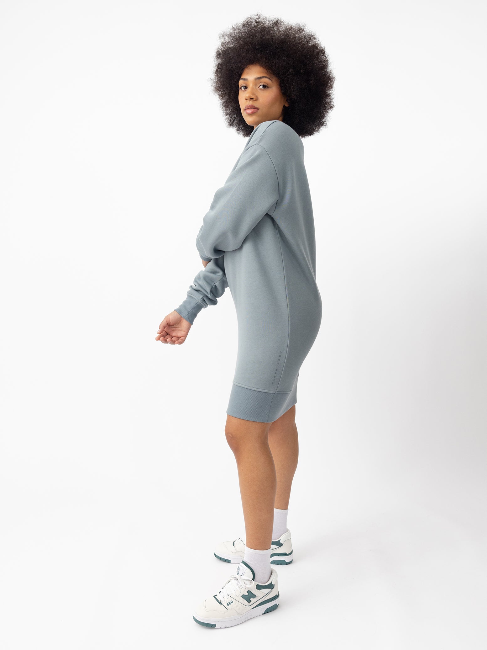 Woman wearing Smokey Blue CityScape Crewneck Dress with white background 