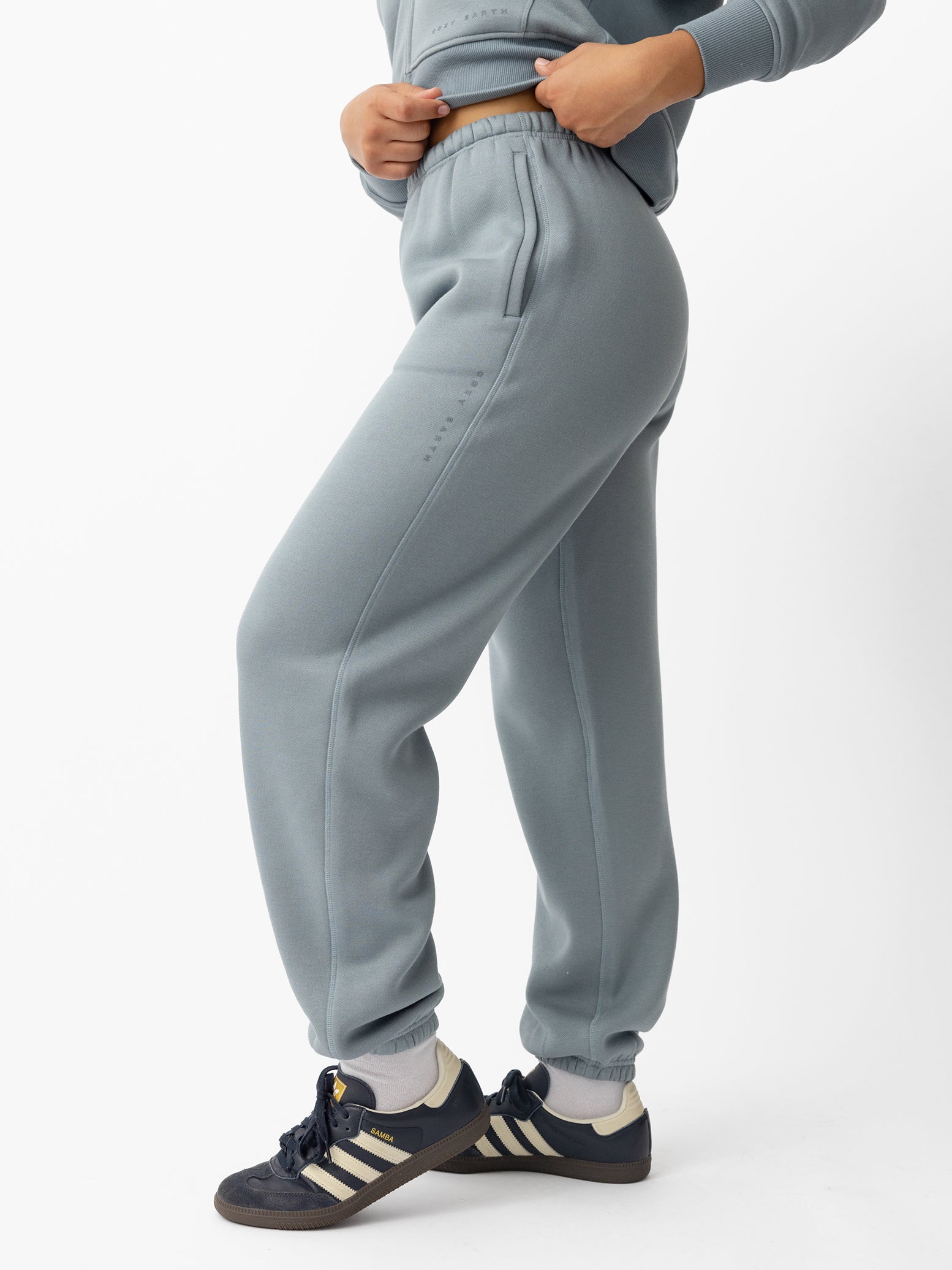 Woman wearing Smokey Blue CityScape Sweat Pant with white background 