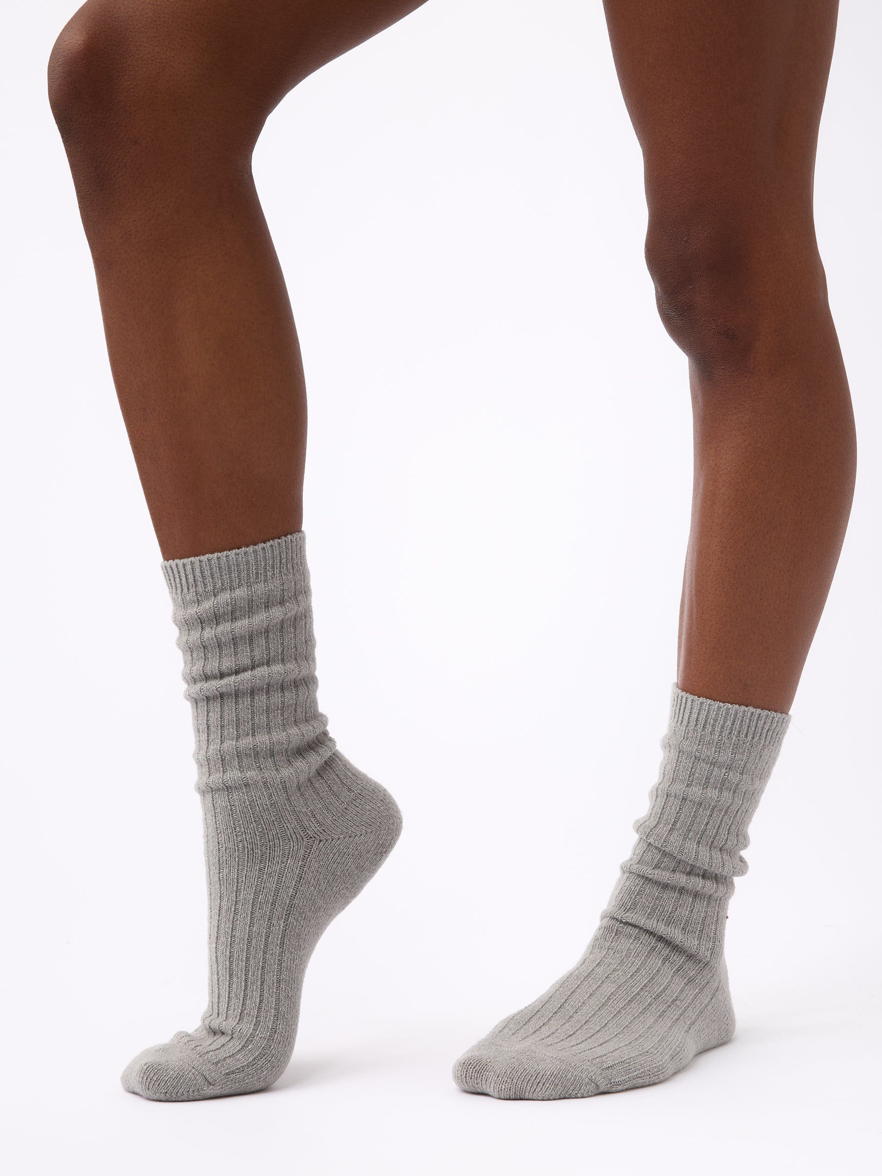 Person wearing Cozy Earth Plush Lounge Calf Sock 1-Pack in Stone 