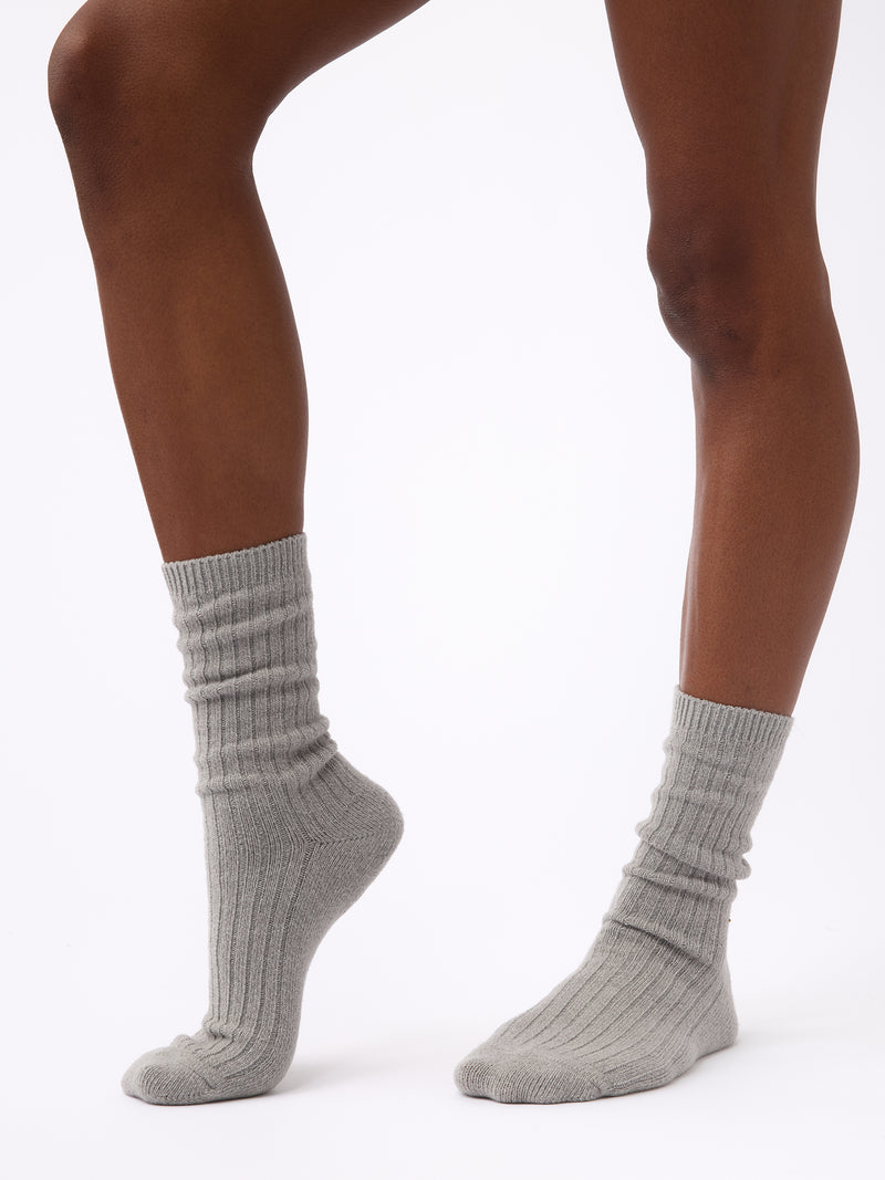 Person wearing Cozy Earth Plush Lounge Calf Sock 1-Pack in Stone
