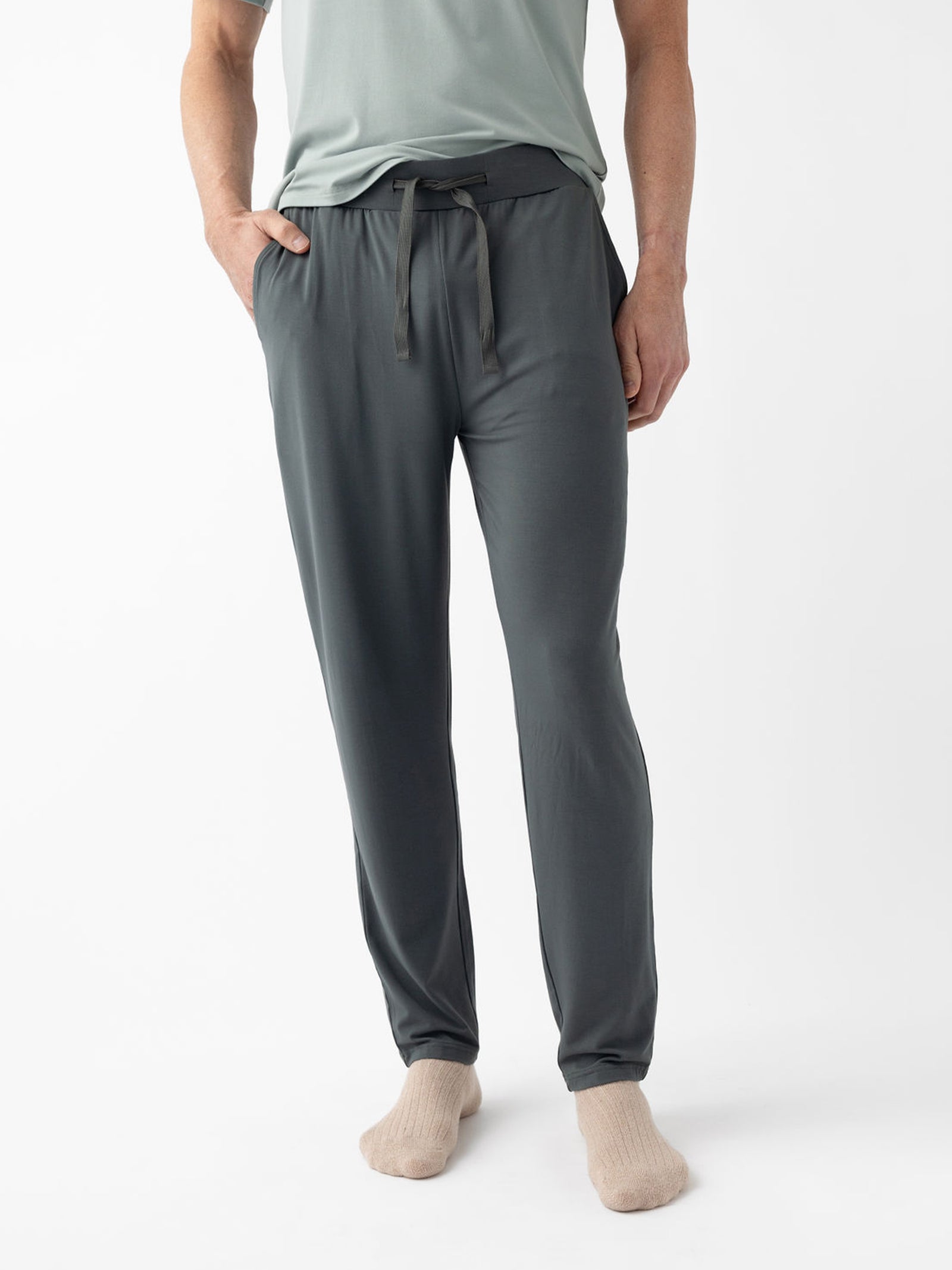 Waste down of man wearing storm pajama pants with white background 