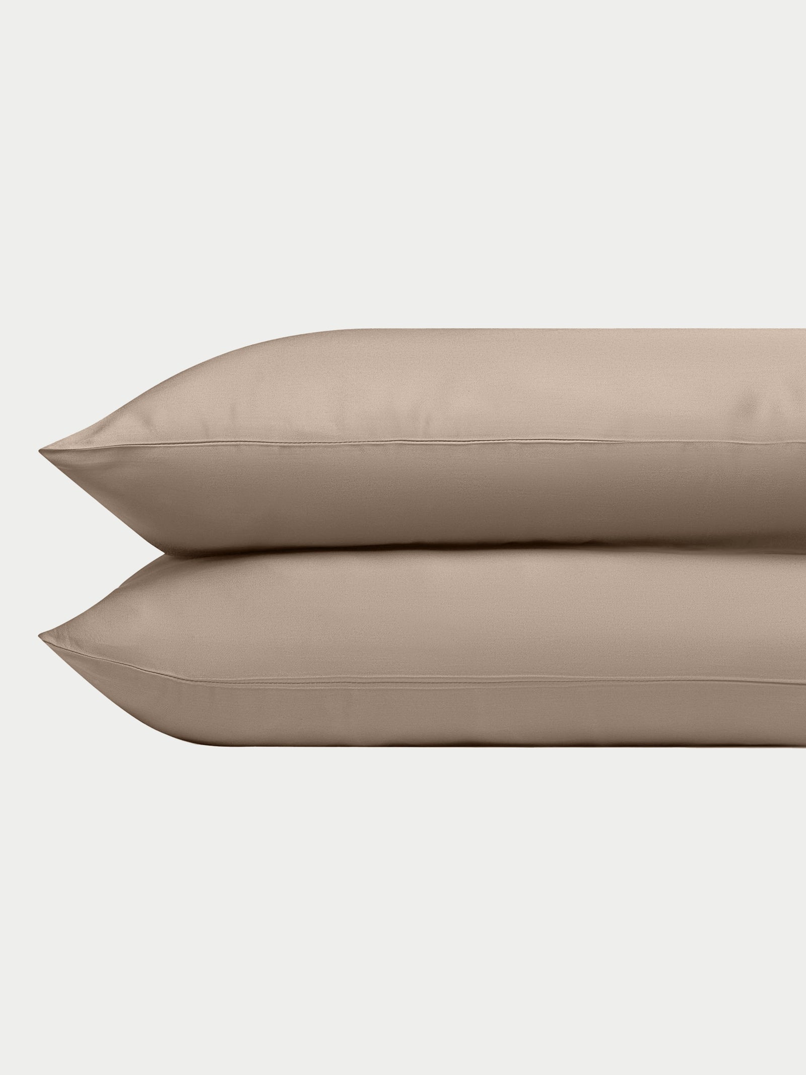 Two walnut pillowcases with a plain background standard/king/body