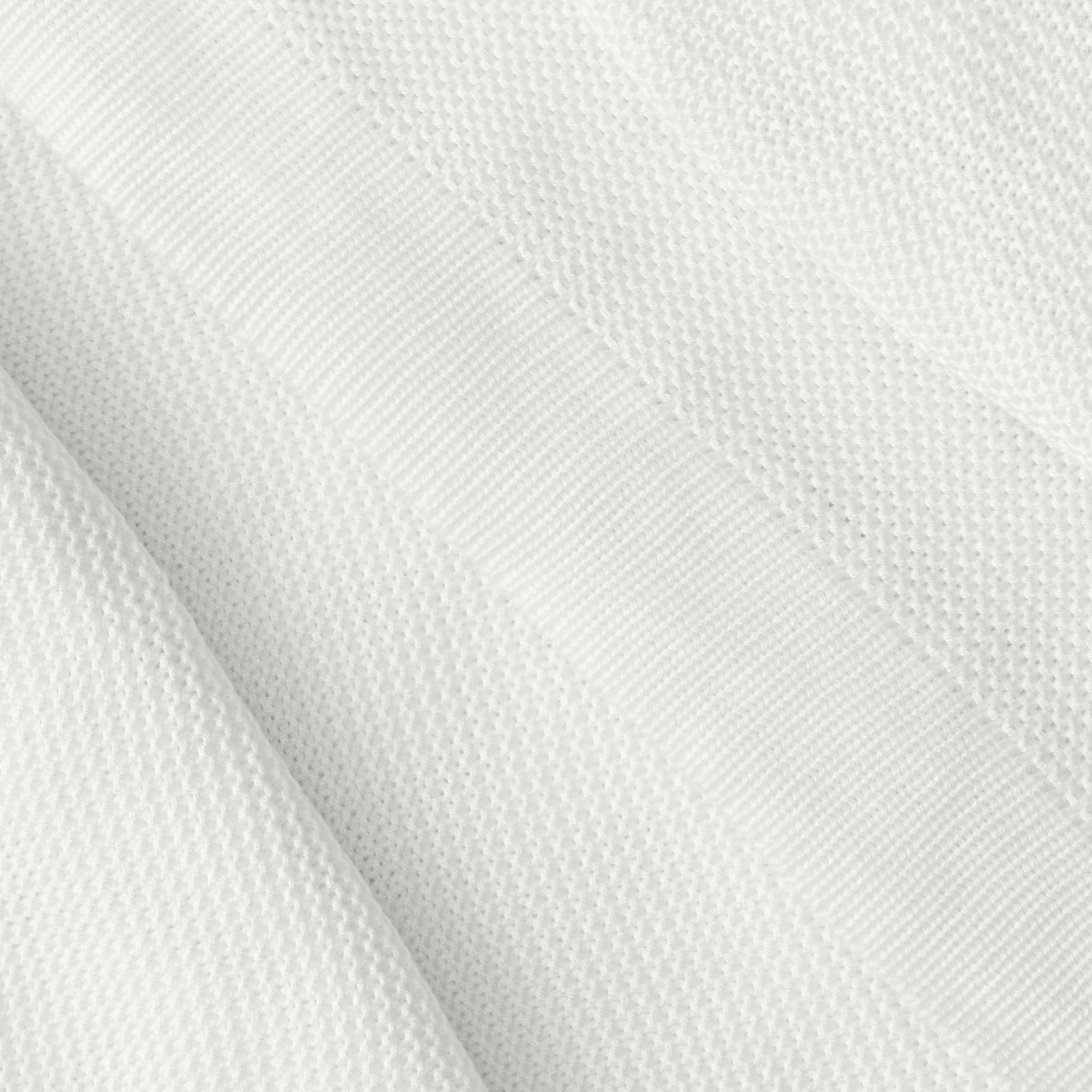 Close up of white cloud knit blanket 