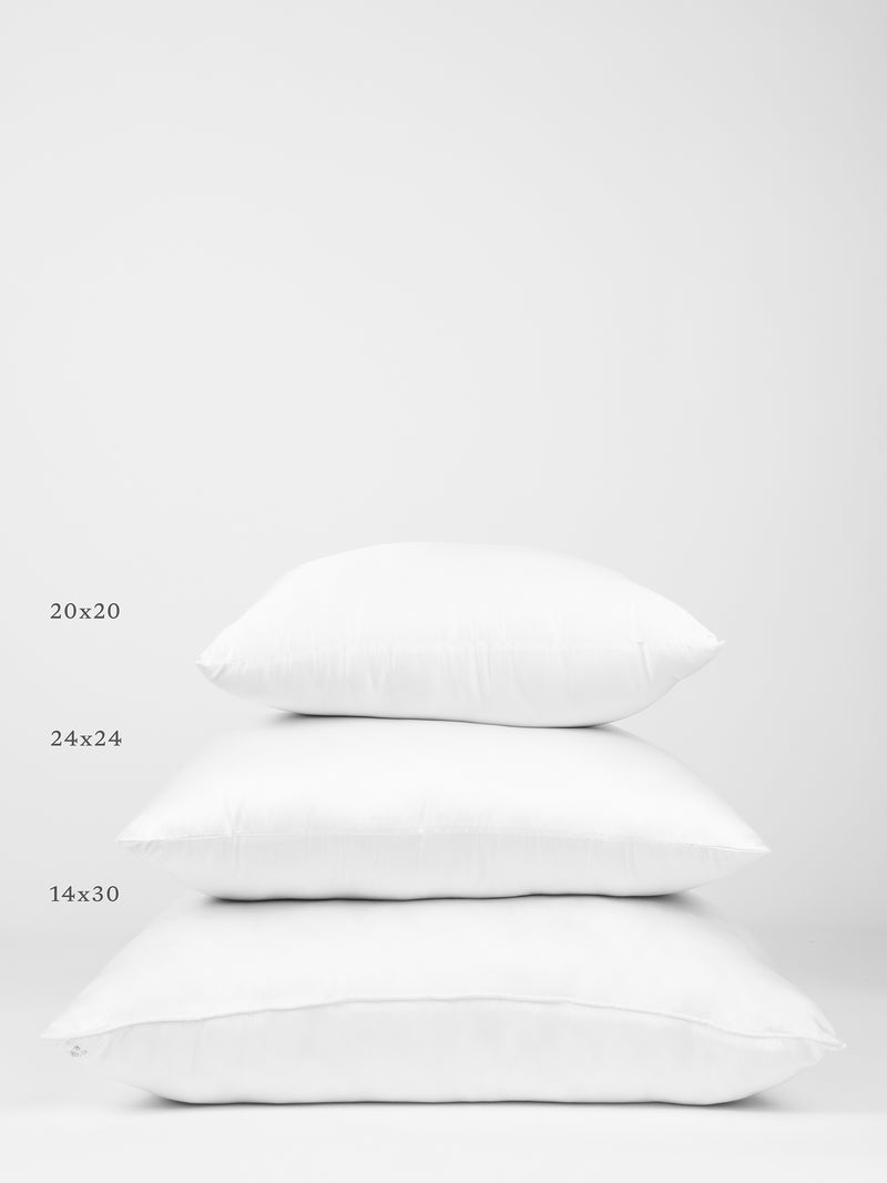 Three Cozy Earth Premium Down Alternative Inserts of different sizes are stacked on top of each other against a white background. The sizes are labeled on the left side as 20x20 (top), 24x24 (middle), and 14x30 (bottom).