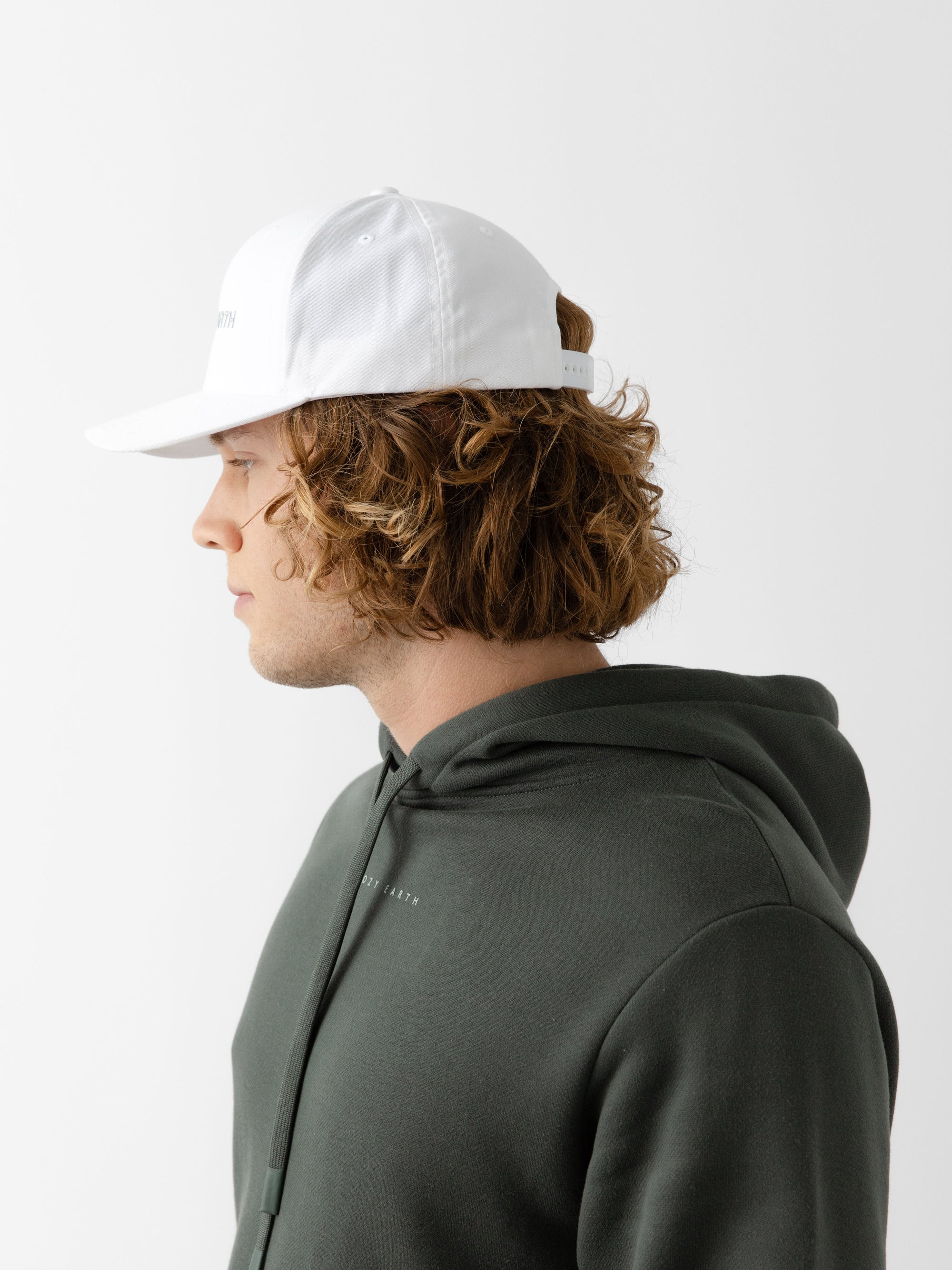A man wearing a White cap on a white background 