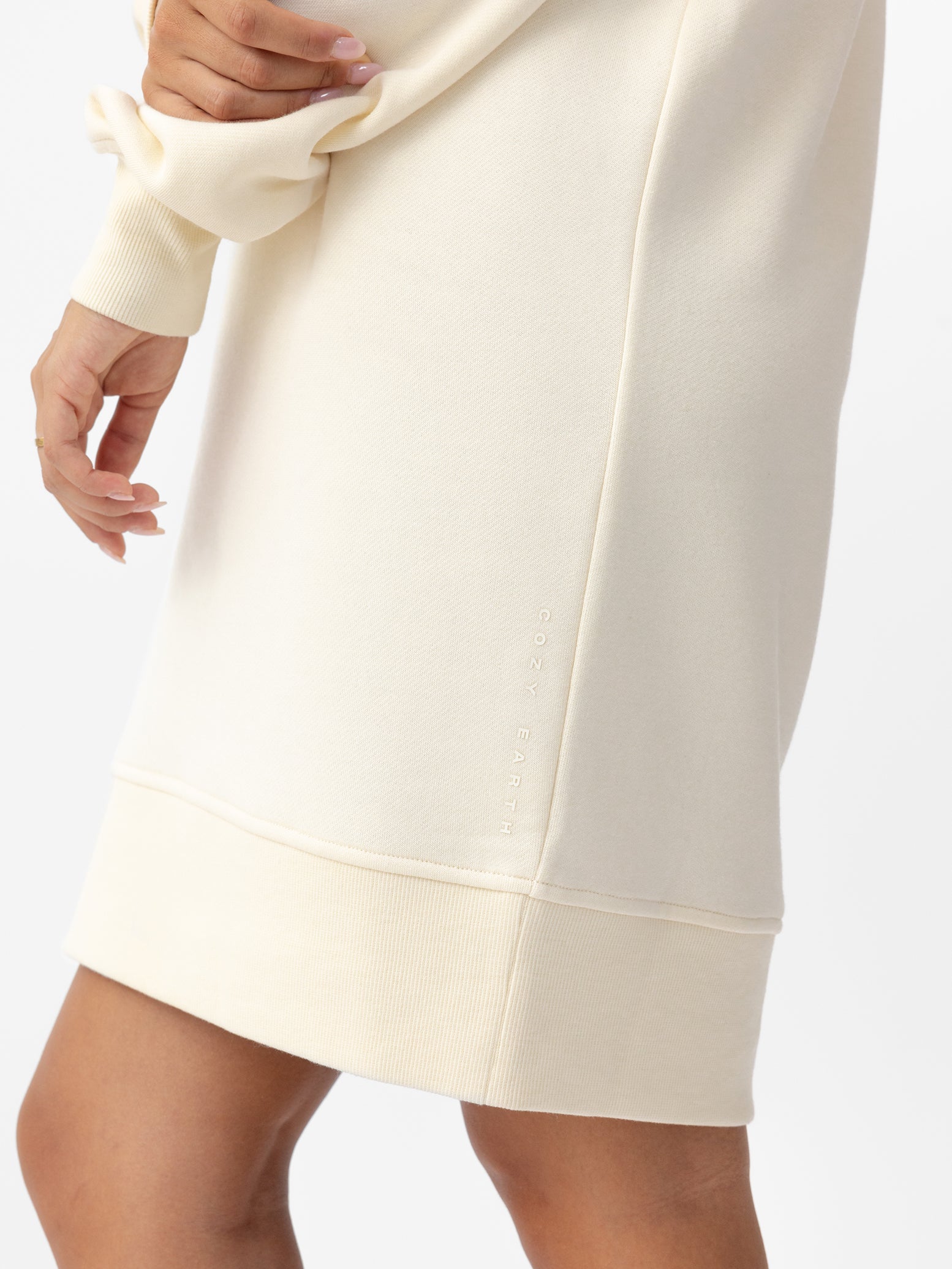 Woman wearing Alabaster CityScape Crewneck Dress with white background |Color: Alabaster