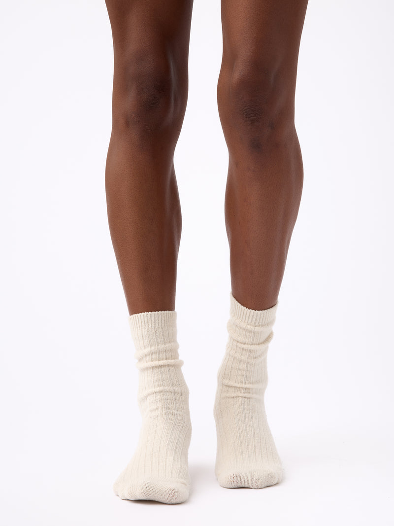 Person wearing Cozy Earth Plush Lounge Calf Sock 1-Pack in Alabaster