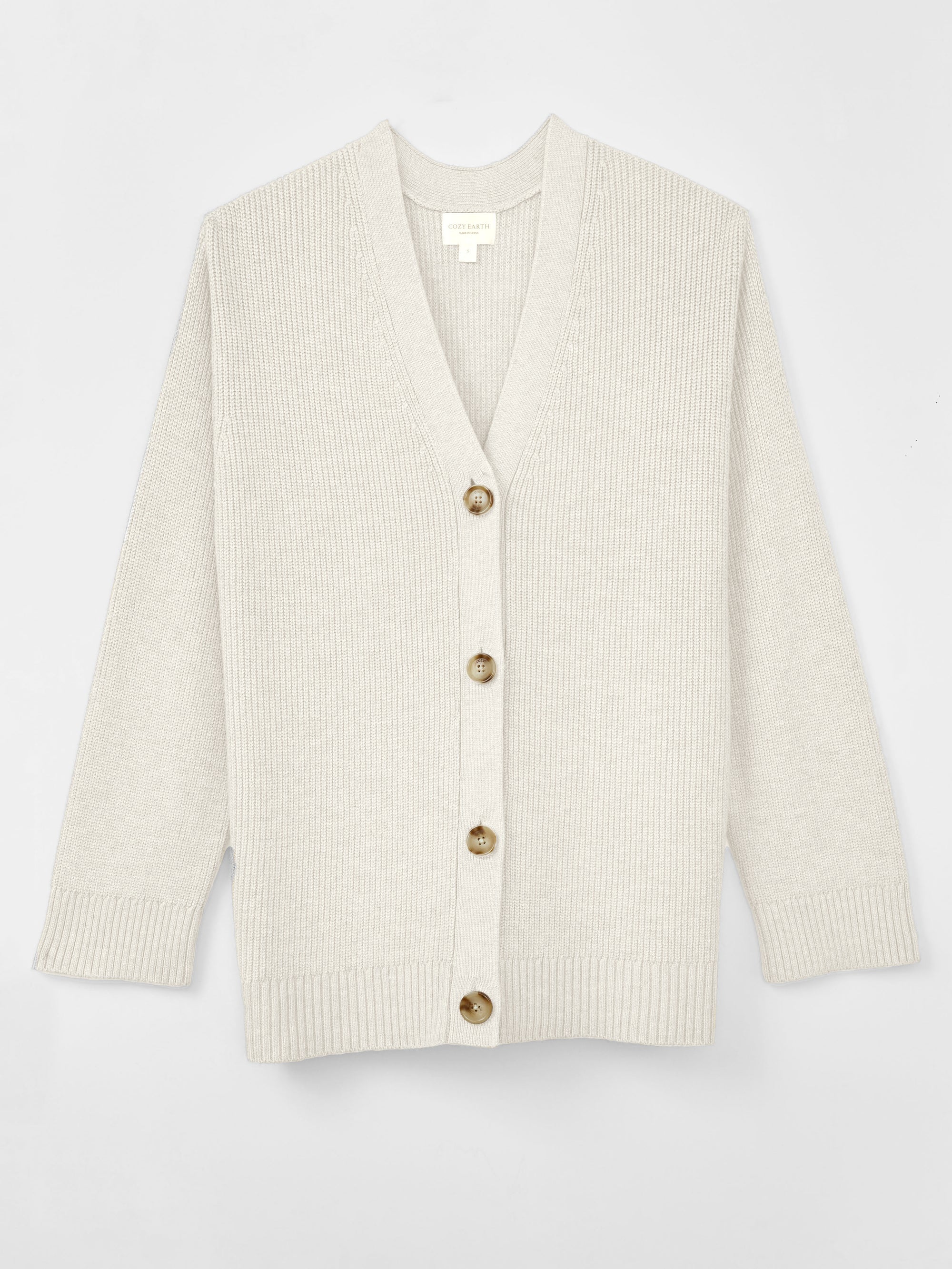 A woman wearing Cozy Earth Classic Cardigan is pictured on a white background 