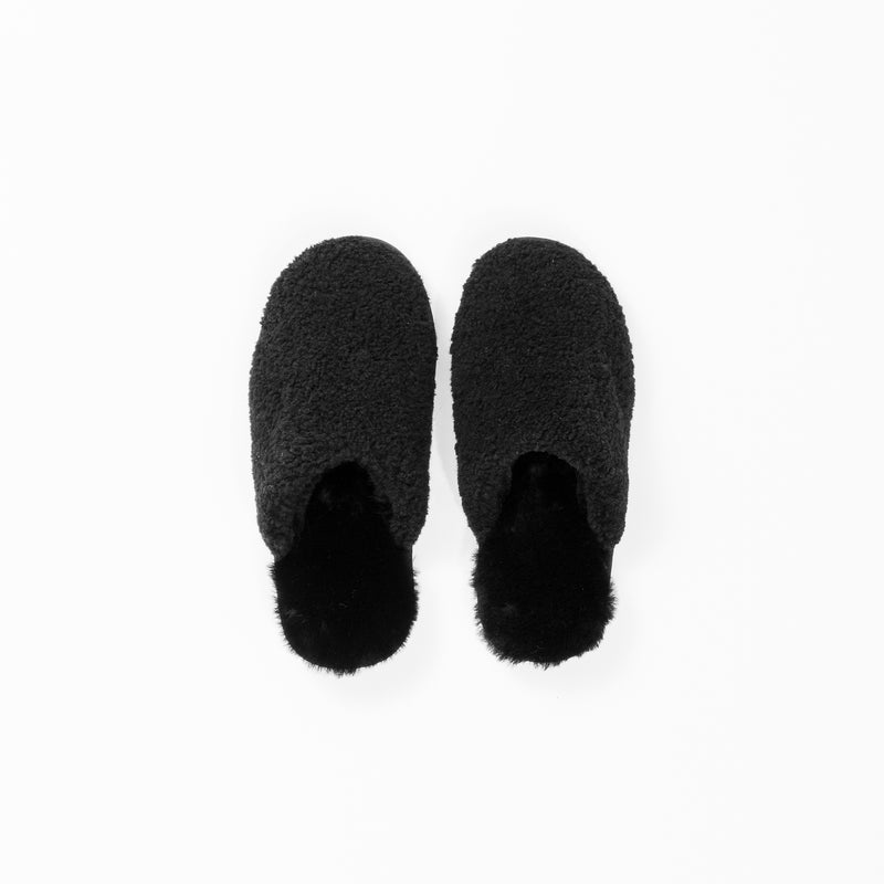 A pair of Puffy Sheep Slippers from Cozy Earth, featuring a soft, plush texture and open backs for a cozy and comfortable look, is arranged side by side on a white background.