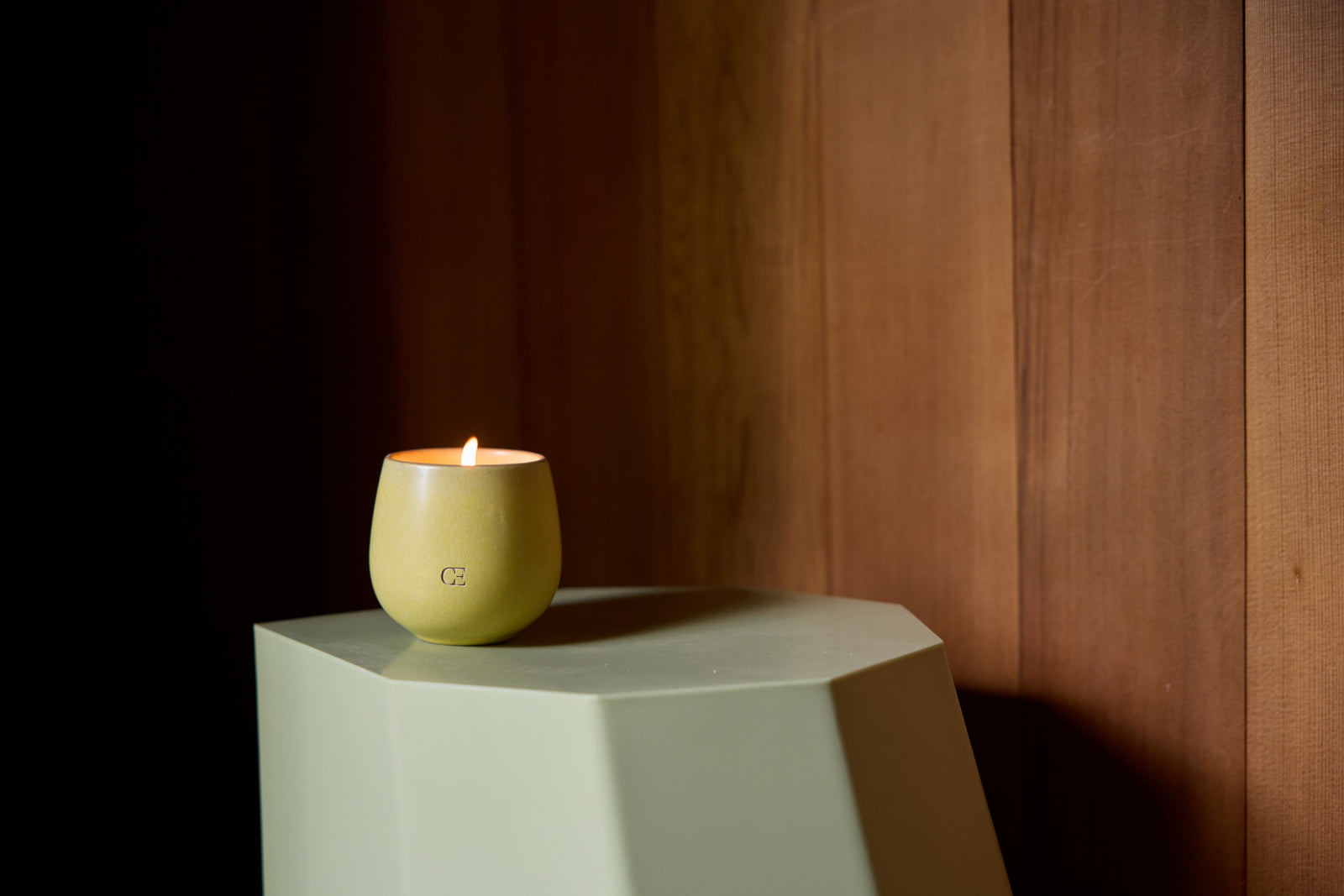 Cozy Earth Bloom Candle sits on a table