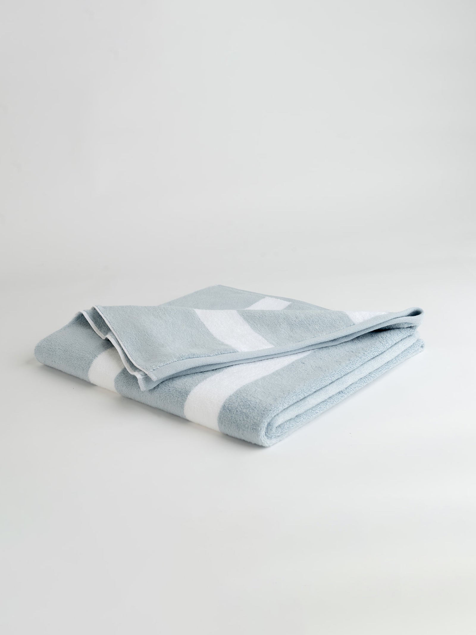 Breeze resort towel folded with a white background 