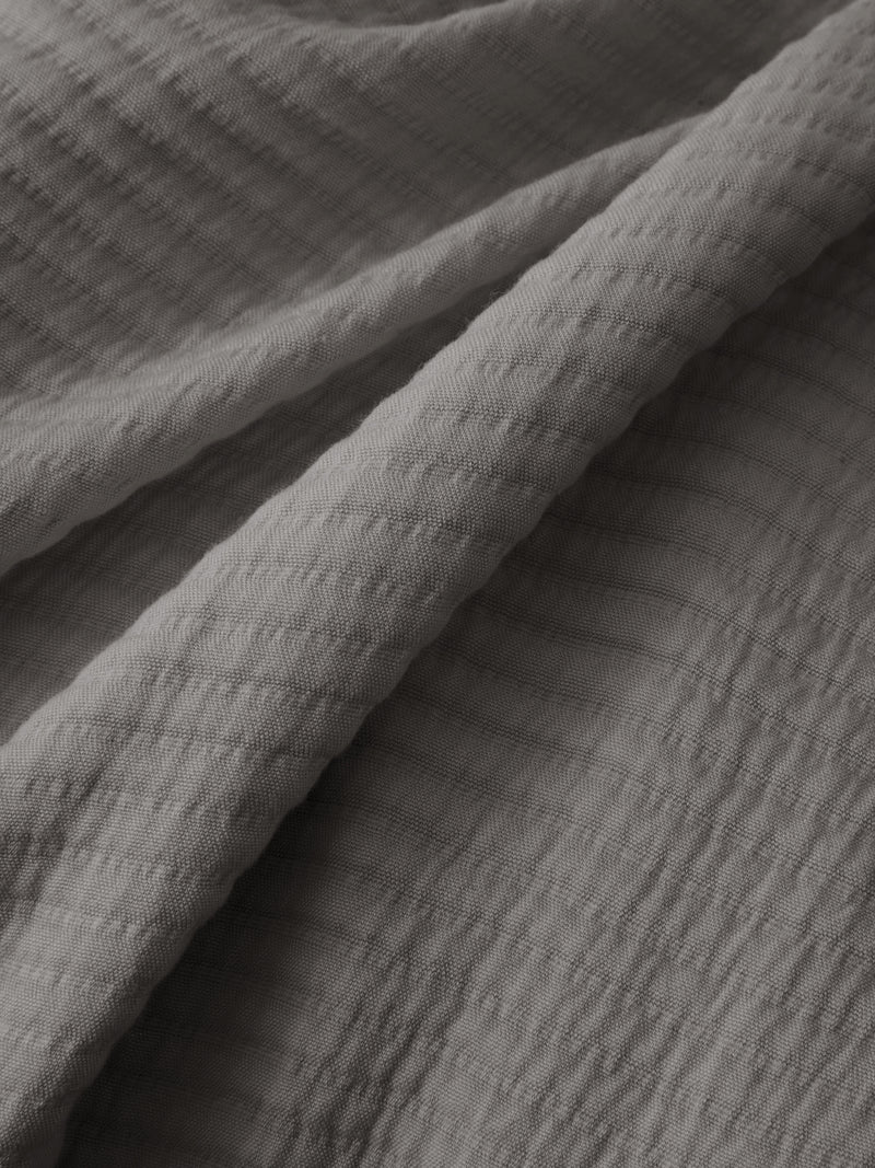 Close up of charcoal coverlet fabric