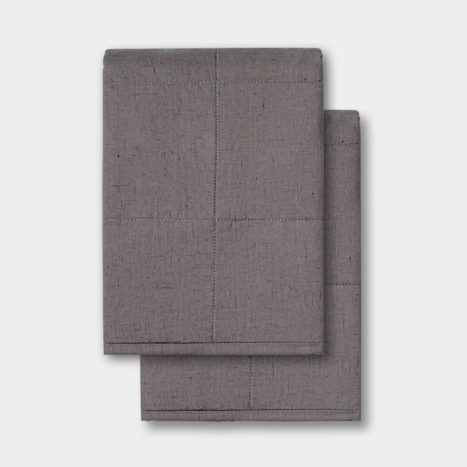 Charcoal Linen Box Quilt Sham neatly folded over white background. 