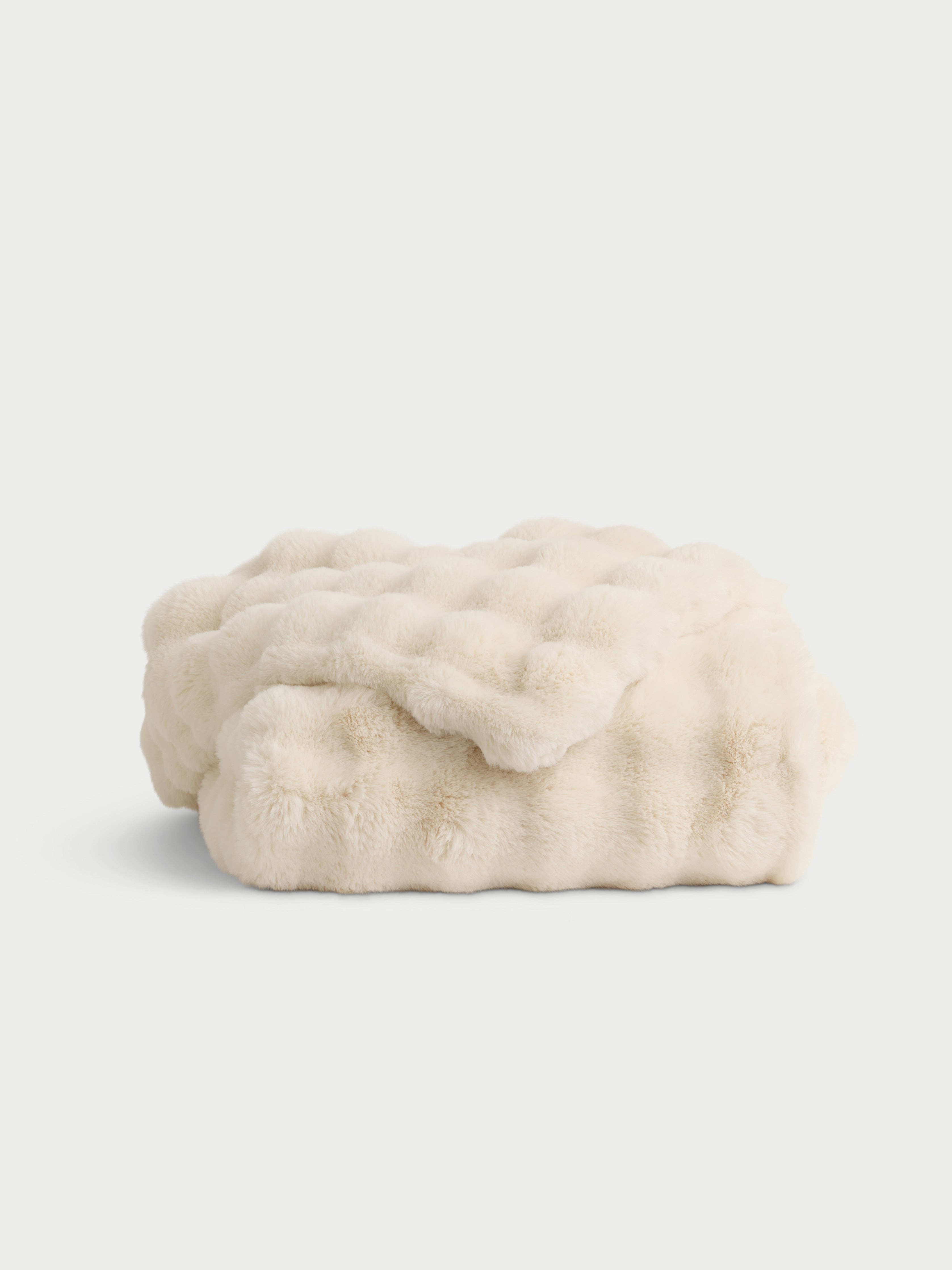 Creme lush faux fur blanket folded with white background |Color:Creme