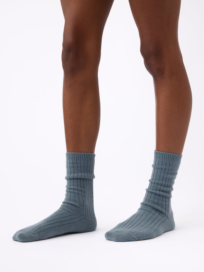 Person wearing Cozy Earth Plush Lounge Calf Sock 1-Pack in Deep Blue