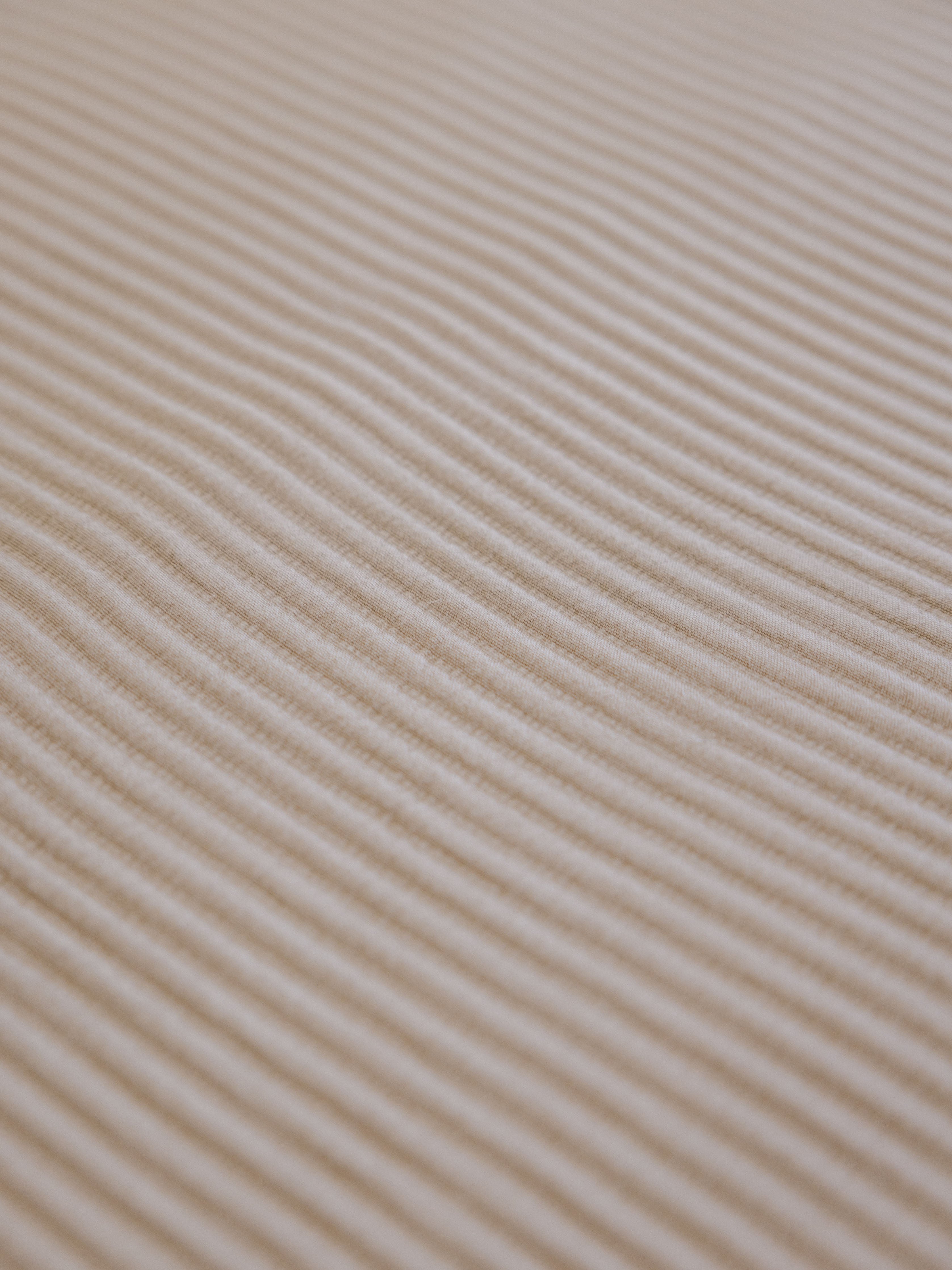 Close up of driftwood coverlet fabric 