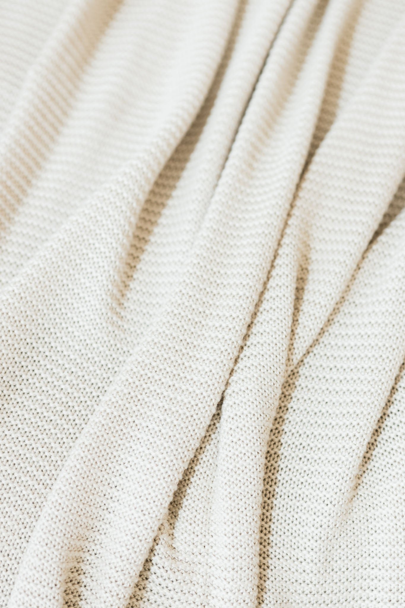 Close up of driftwood cloud knit blanket 