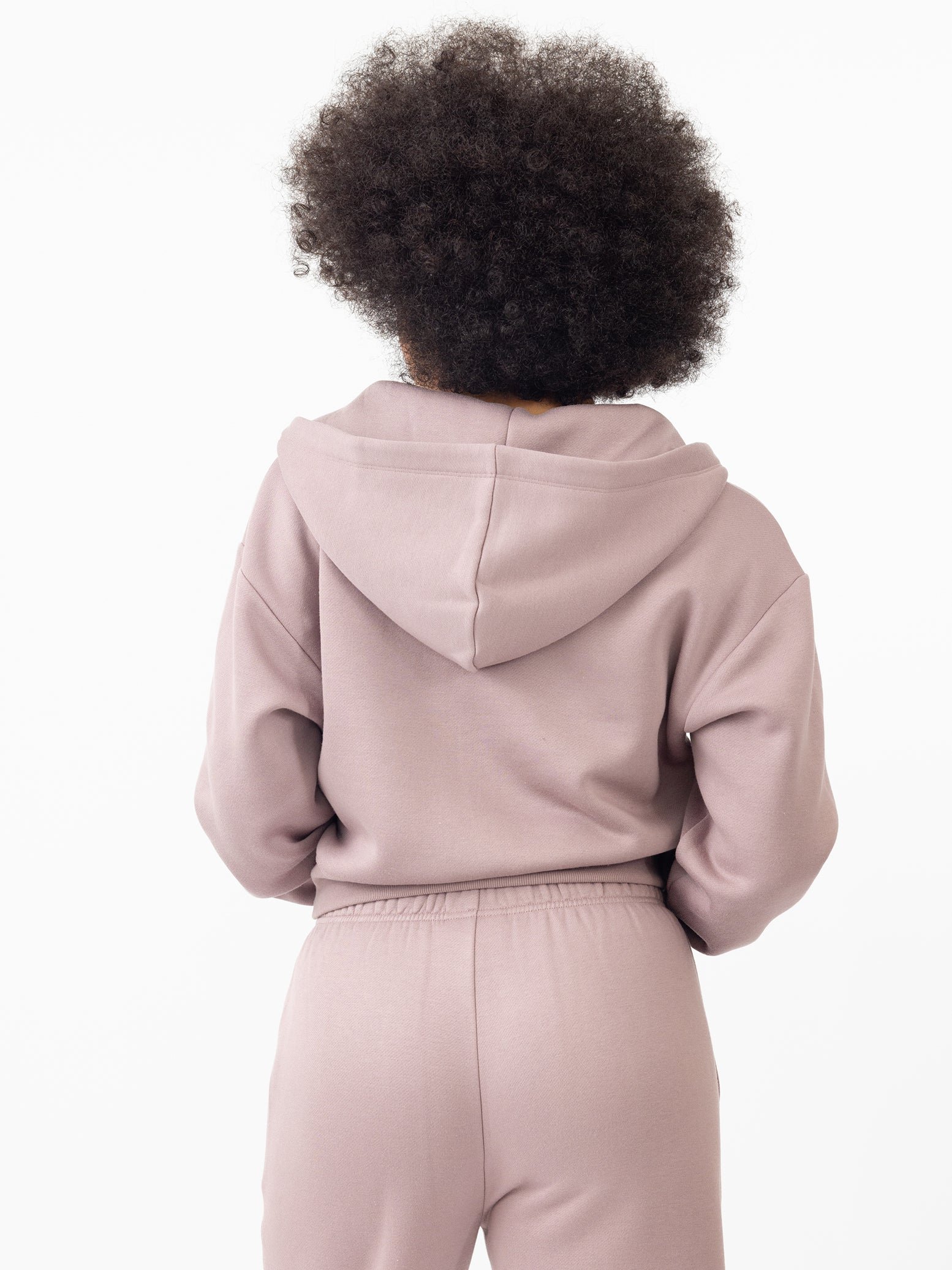 Woman wearing Dusty Orchid CityScape Cropped Full Zip with white background 